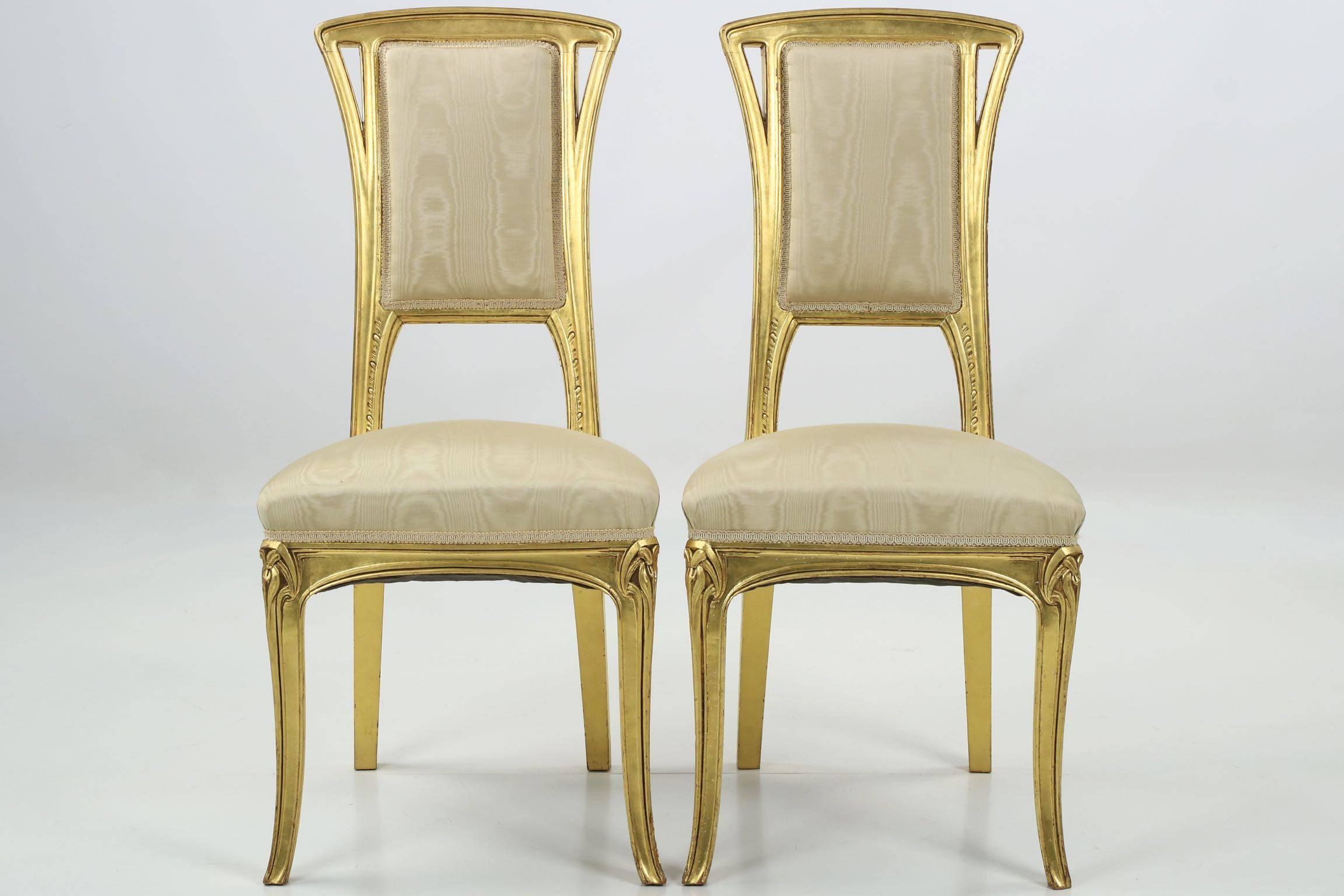 A perfectly designed and proportioned pair of giltwood side chairs, designed almost certainly by the firm of Louis Majorelle during the first years of the 20th century, they exhibit precise and gorgeous craftsmanship throughout their remarkably