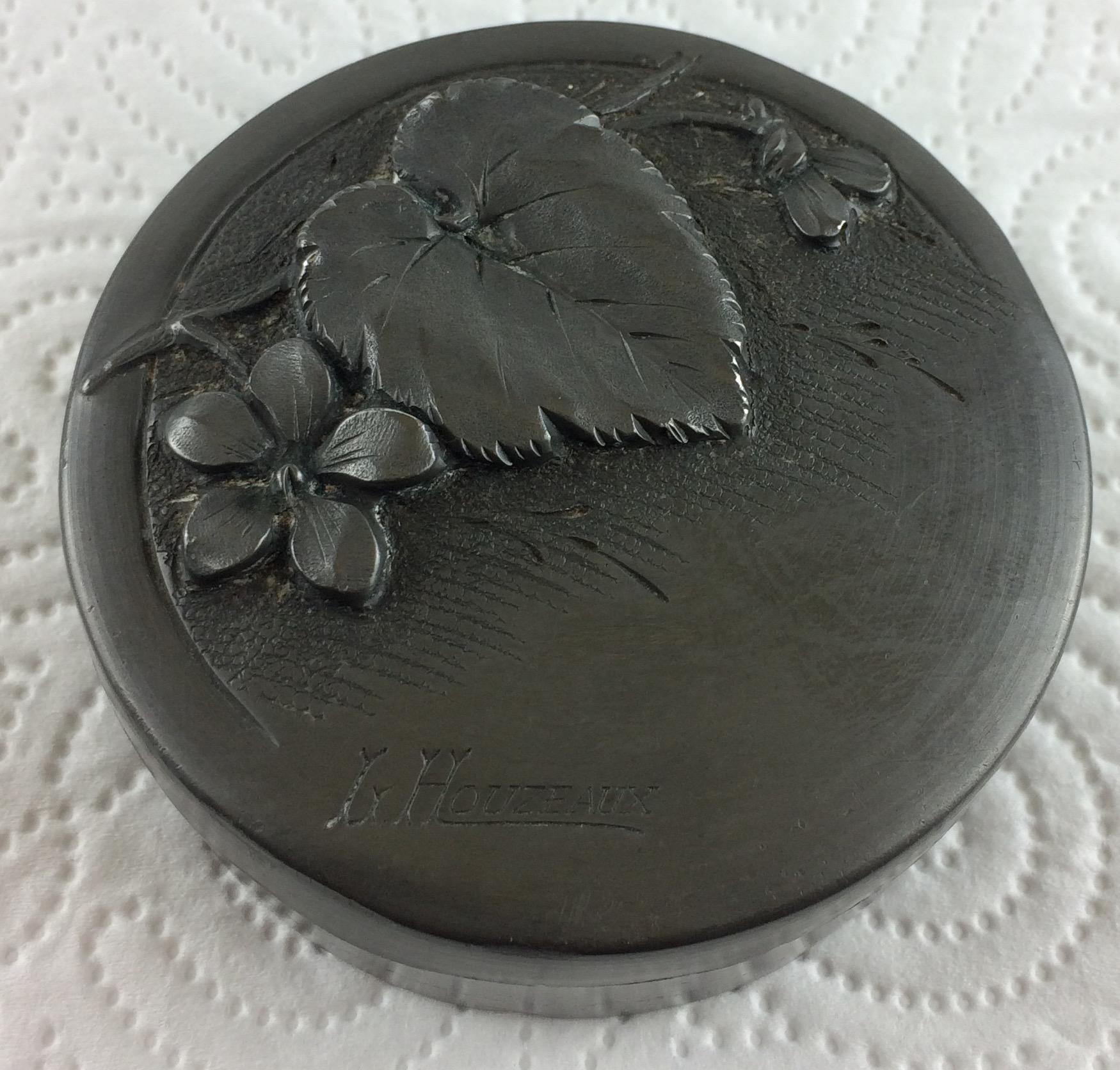 Elegant French Art Nouveau uniquely illustrated pewter covered box by Louis Houzeaux. Generously sized handwrought with typical Art Nouveau floral embossed design. Engraved signature on top and also stamped on the underside from the famous 
