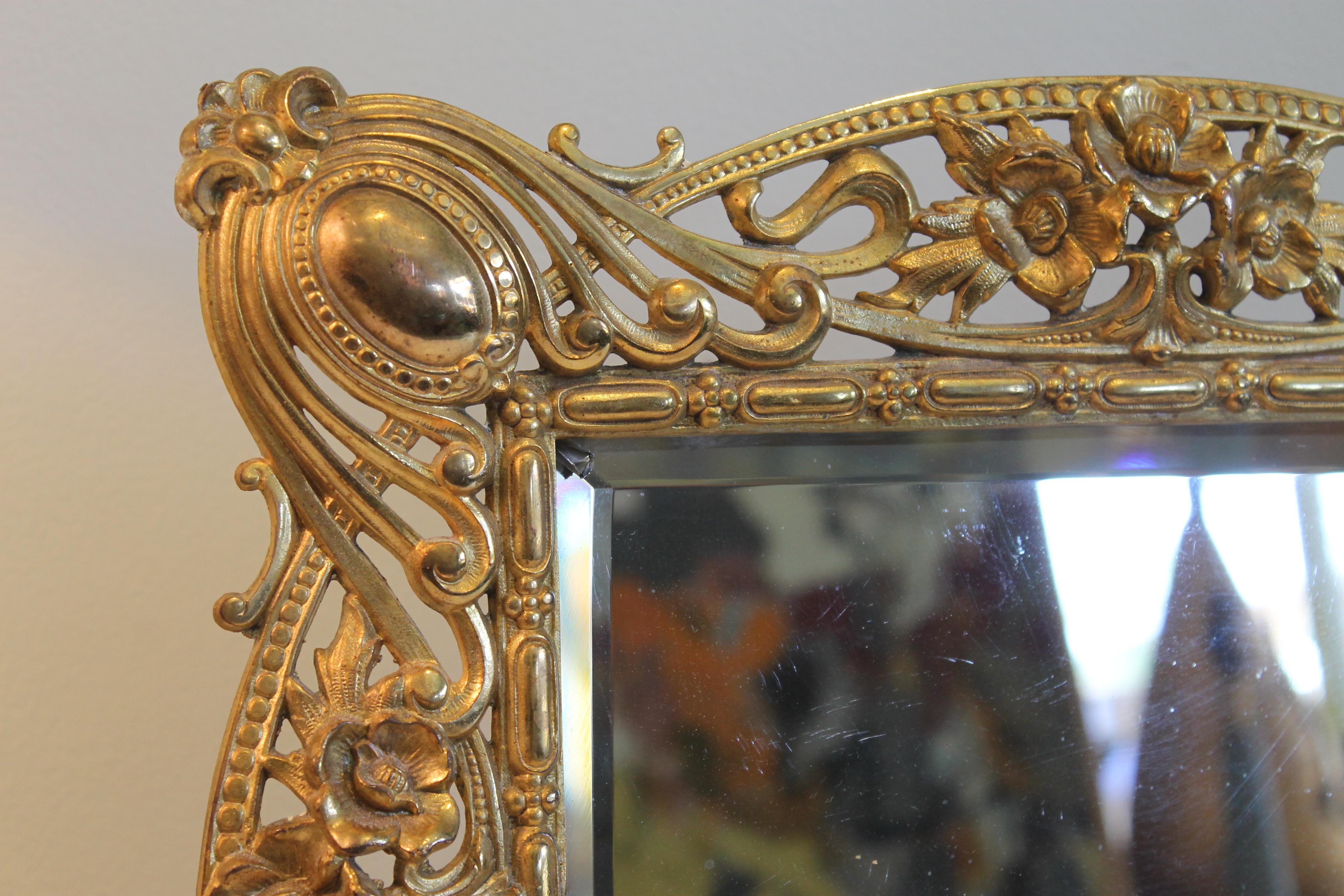 Monumental Art Nouveau picture frame. Frame has original glass which shows sign of wear.  There's a small piece of glass missing in the upper left hand corner.  Frame measures 17