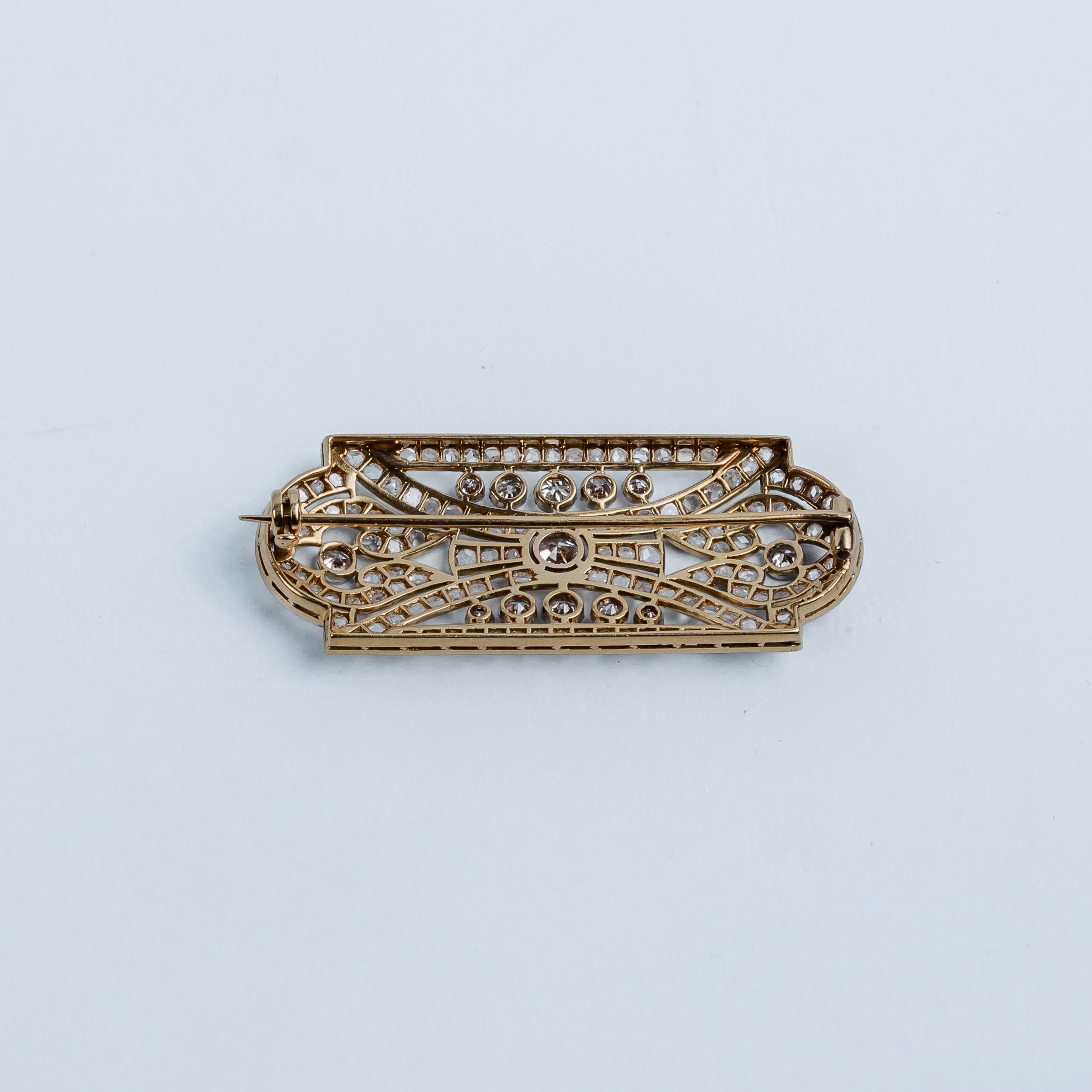 Art-Nouveau pin brooch in rose gold with knurled platinum setting and a clean central diamond. All the bands are knurled platinum full of diamonds.

MATERIALS
◘ Weight 10.2 grams 
◘ Size 21x51.5cm / 8.26x20.27inch. 
◘ Central Diamond aprox 0.25ct
◘