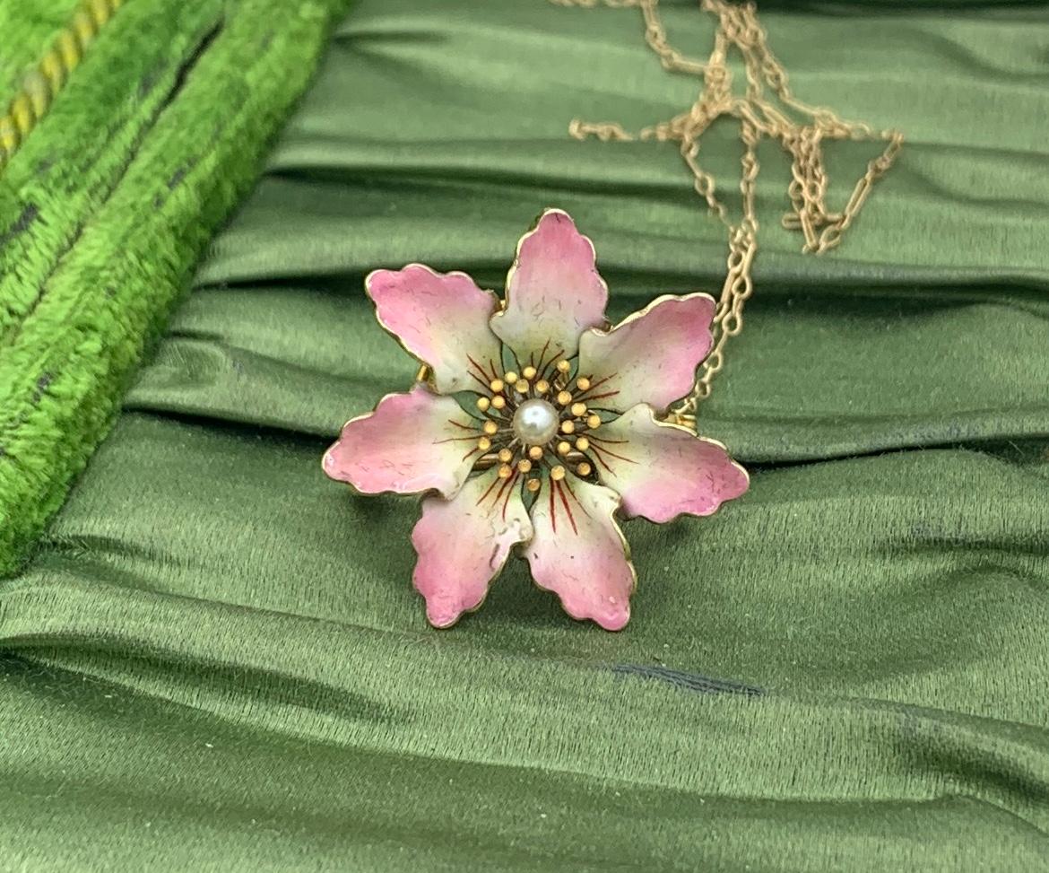 THIS IS A GORGEOUS VICTORIAN - ART NOUVEAU PENDANT NECKLACE WITH A BEAUTIFUL PINK AND CREAM ENAMEL FLOWER WITH A PEARL IN THE CENTER AND EXTRAORDINARY LUMINESCENT INDIVIDUAL STAMENS AROUND THE PEARL.  THE NECKLACE IS 14 KARAT GOLD AND IS ONE OF THE