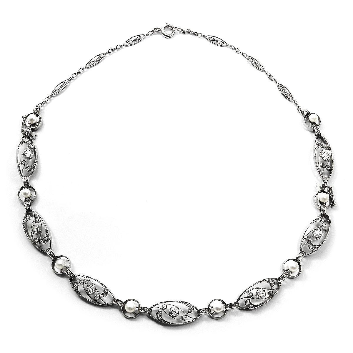 Art Nouveau Platinum Diamond Pearl Dual Bracelet / Necklace, Paris circa 1915

Two looks in one piece! This bracelet can be extended with a corresponding chain to become a choker necklace.

This delicate platinum bracelet features an openwork design