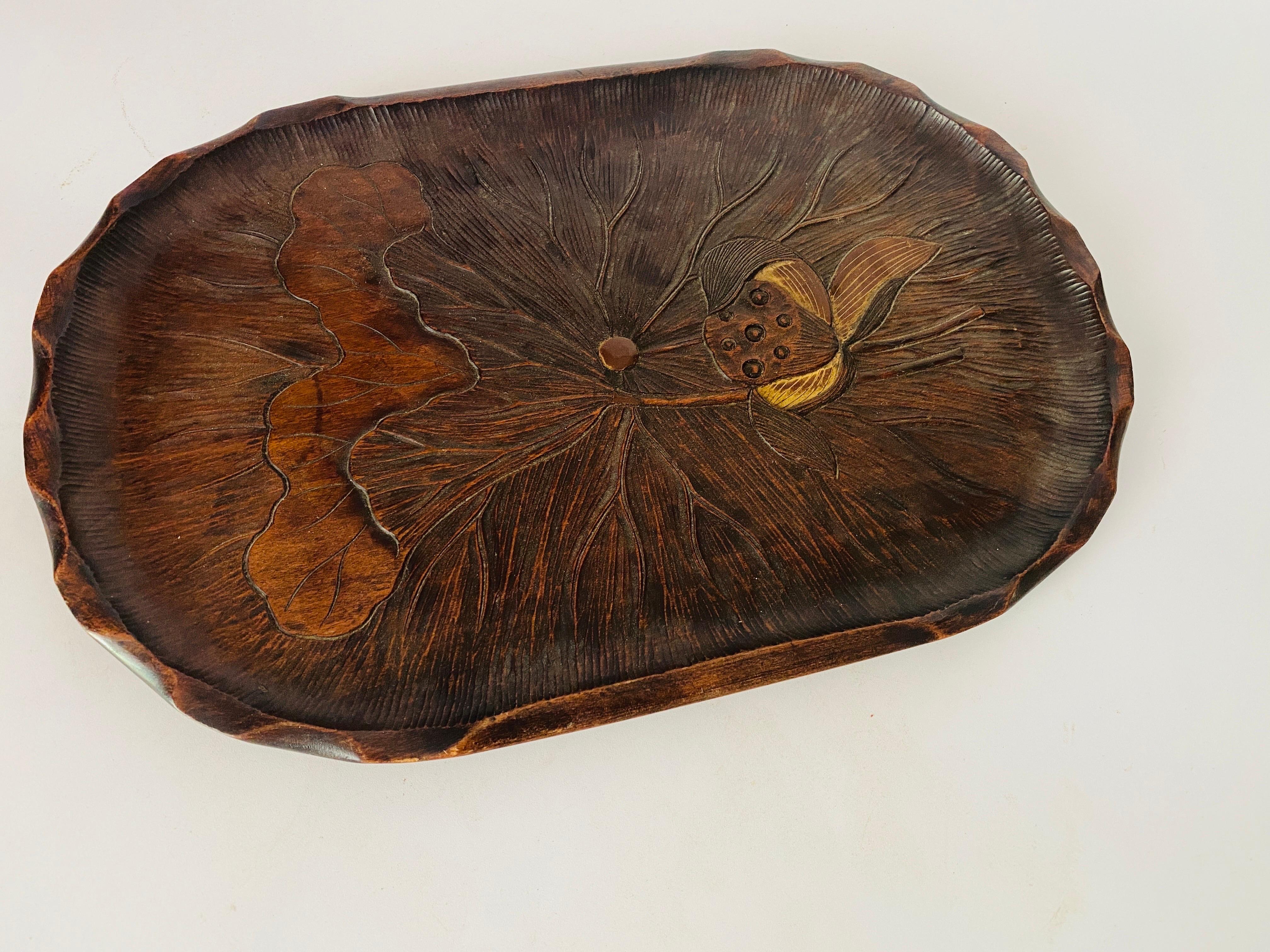 This tray is a tray from the Art Nouveau period. It is in wood, , Its shape is oval- retangular, , it was made in the 1930s in France.
The top is filled with hand carved florals motif decorations.