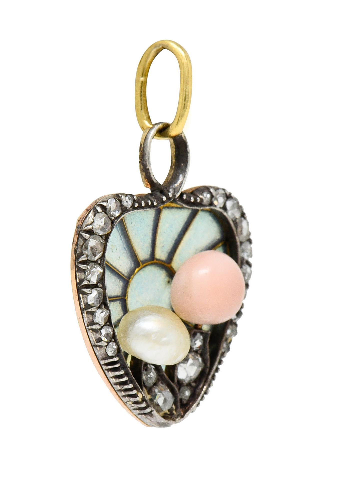 Heart shaped pendant charm designed as a radiating burst motif featuring translucent cornflower blue plique-á-jour - no loss

Depicting two stylized mushrooms one topped by a pink Conch pearl while other is topped by a white baroque pearl

Accented