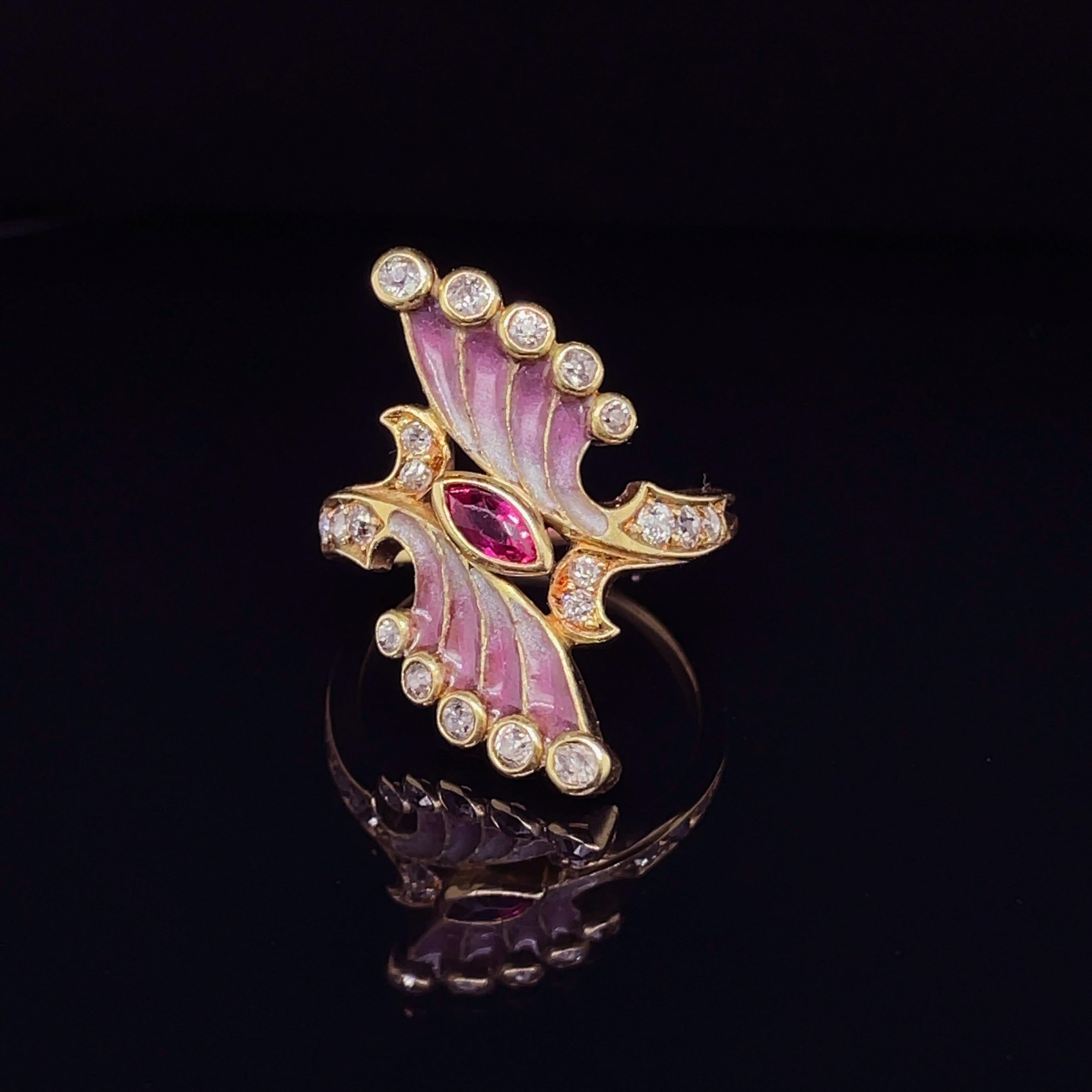Art Nouveau Plique-a-Jour Enamel Ruby and Diamond Ring, ca. 1900s

A beautiful Art Nouveau ring from the 1900s, centring a marquise shaped ruby and featuring beautiful gradient window-enamelled wings, suspending and surrounded by old-cut diamonds.