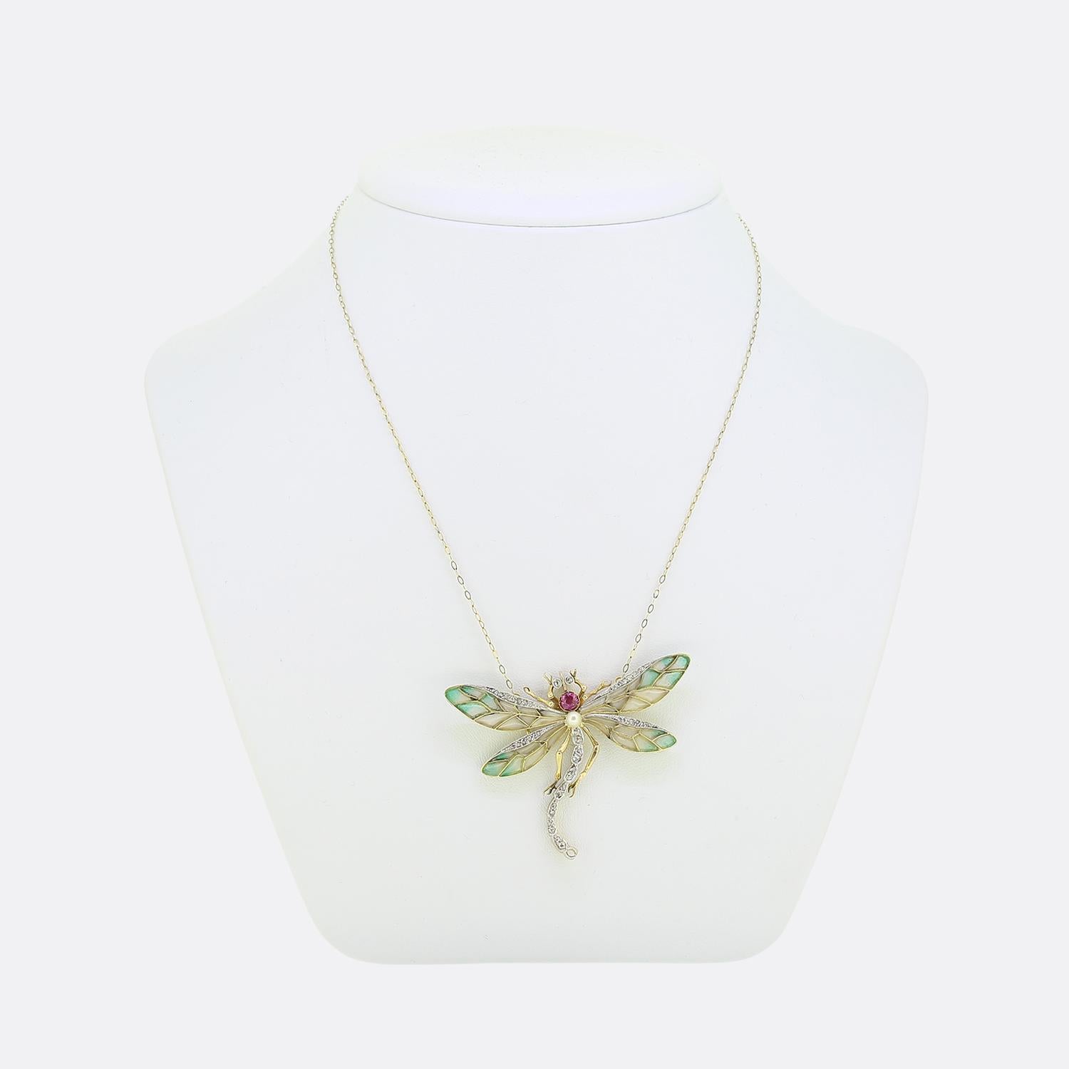 Here we have an outstanding necklace crafted during the pinnacle of the Art Nouveau movement. This rare and unique piece has been curated from a warm 18ct yellow gold into the shape of a dragonfly and displays a breathtaking use of the plique-a-jour