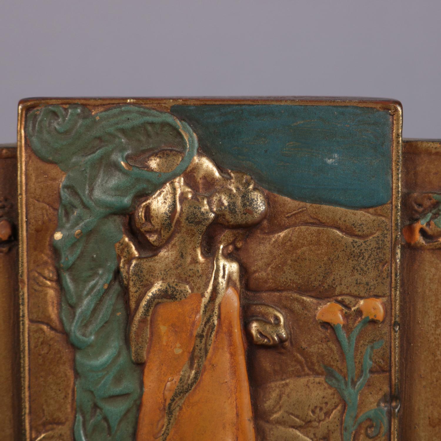 Art Nouveau bookends feature bronzed and polychromed high relief design after Gustav Klimt's 