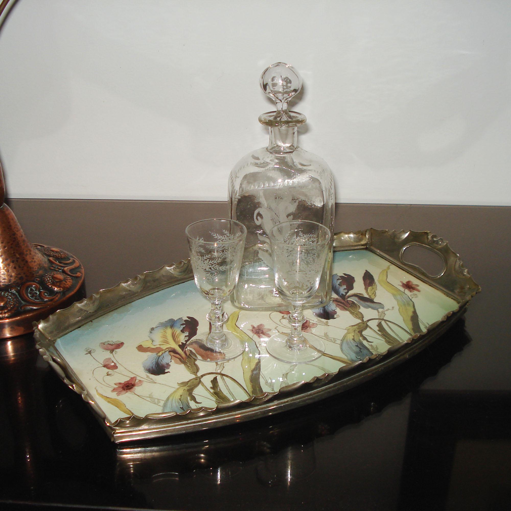 Art Nouveau Porcelain and Pewter Tray by Max Dannhorn, Villeroy & Boch for Nürnberger Metallwarenfabrik Max Dannhorn.
An Art Nouveau serving tray, beautifully polychrome transfer decoration with iris, silver-plated pewter mount.
Traces of