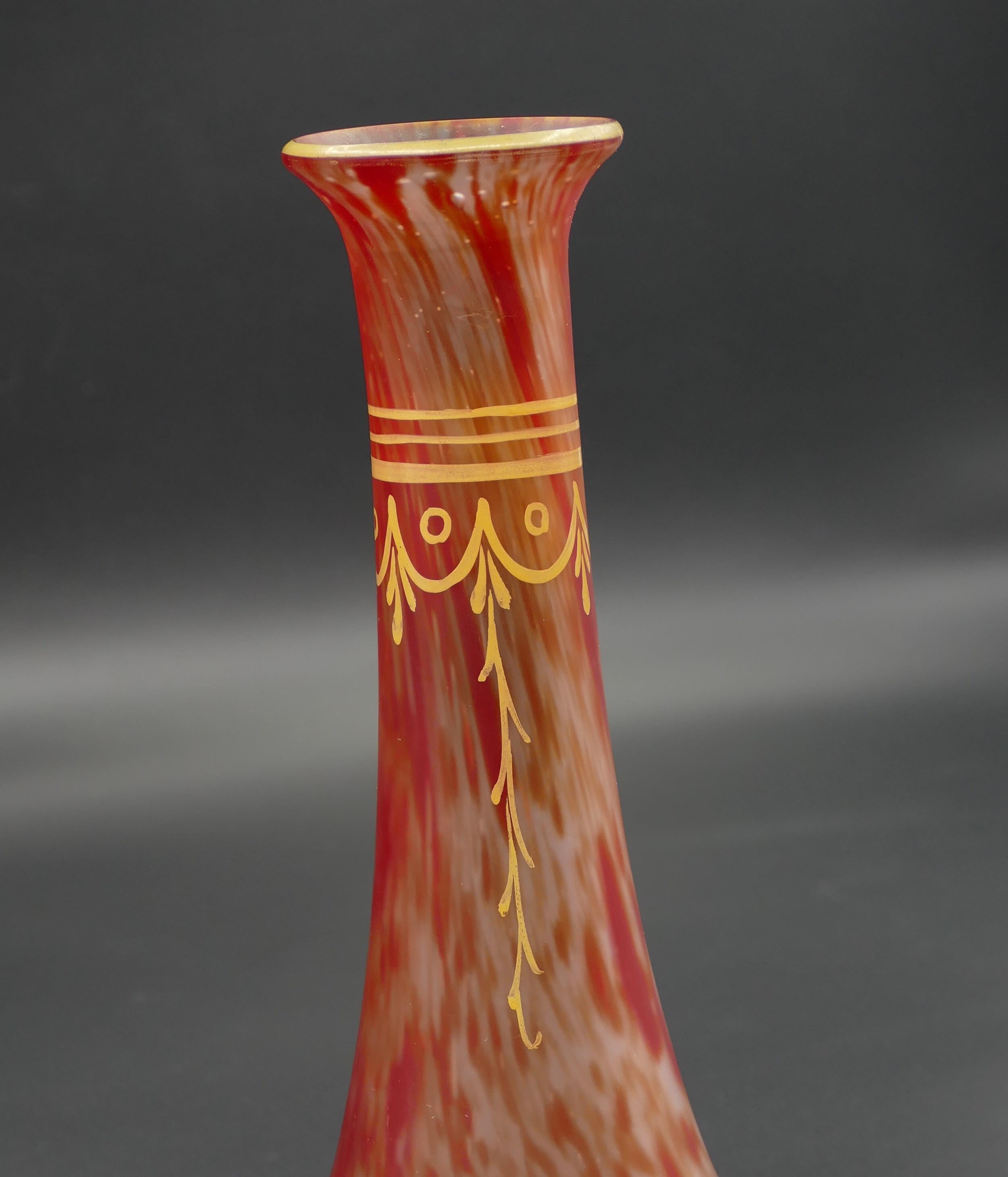 Red marbled vase is an original decorative object realized in the first decade of the 20th century.

Made in France. 

Original colorless matte glass with red melted marbling and yellow ornamental painting.

Signed: Leg.

Mint conditions.