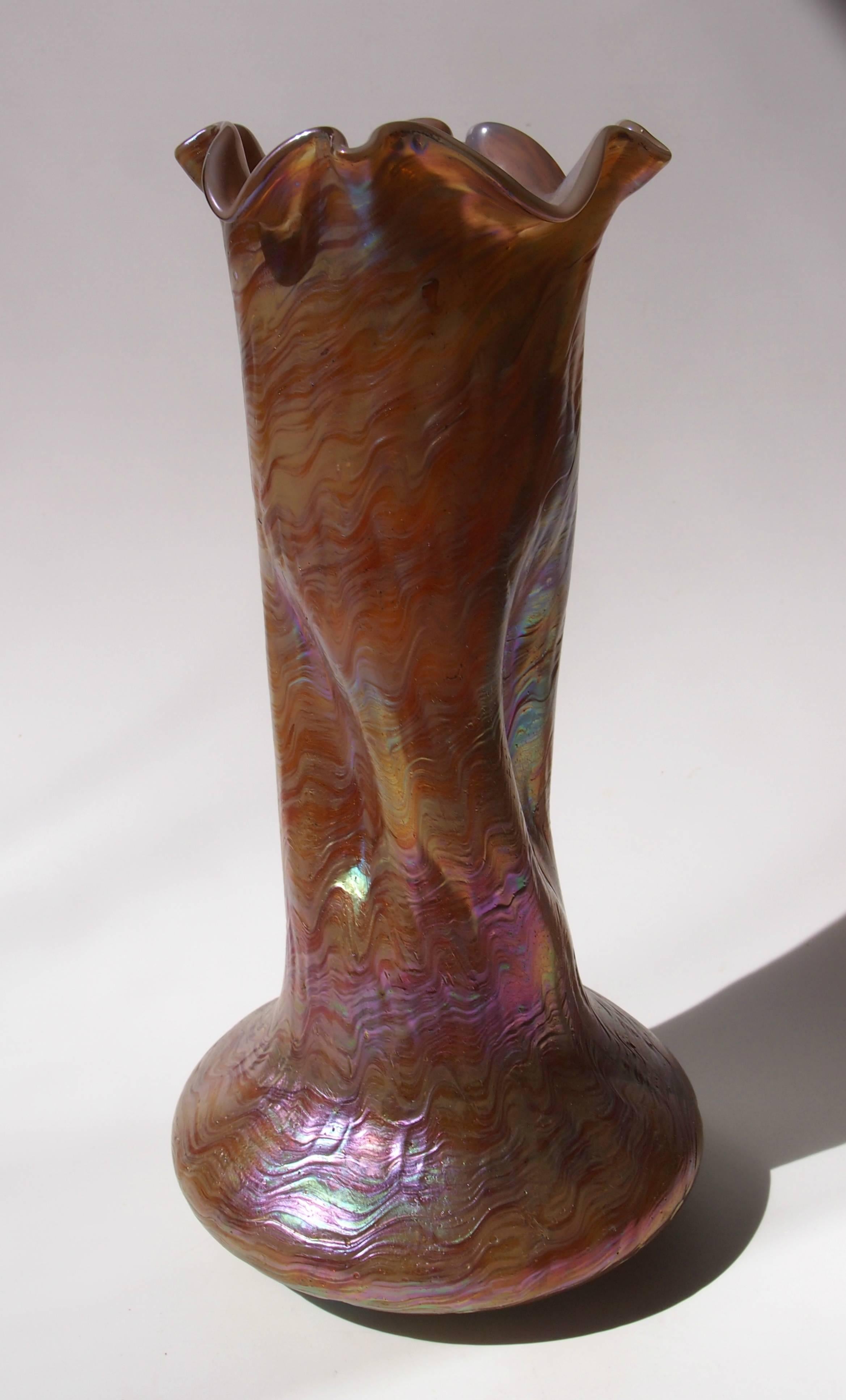 Impressive Art Nouveau Rindskopf iridized brown on cream opal base vase with impressed dimples and hand tooled top. The glass vase is a great period shape and an exceptional color.

Rindskopf was one of the great Bohemian iridized glass makers at