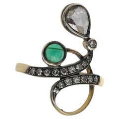 Art Nouveau ring with emerald and diamonds, circa 1900.