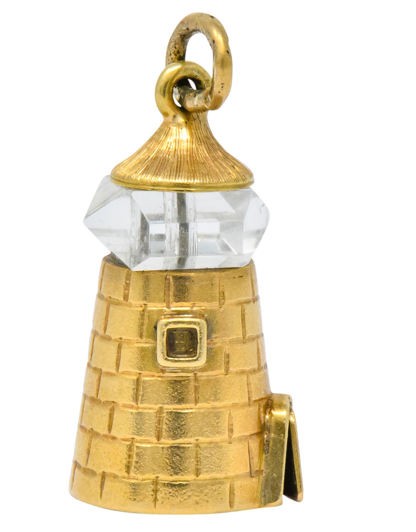 Lighthouse charm with engraved detailing and door slightly ajar

With faceted rock crystal bead that spins in place as lantern room

Stamped 14k for 14 karat gold

Measures: approx. 3/8 x 7/8 (including bale)

Circa 1910

Total weight: 2.3