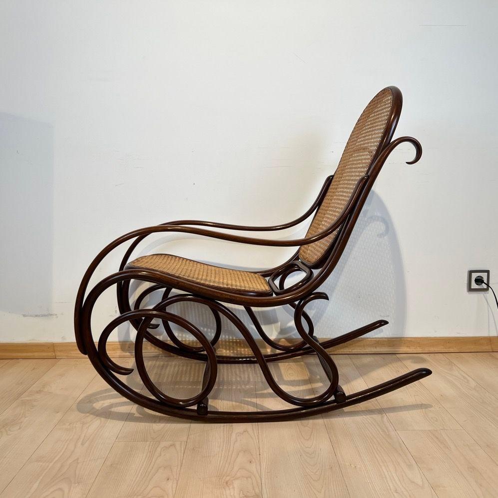 Austrian Jugendstil Rocking Chair by Thonet, Stained Beech, Weave, Austria circa 1910 For Sale