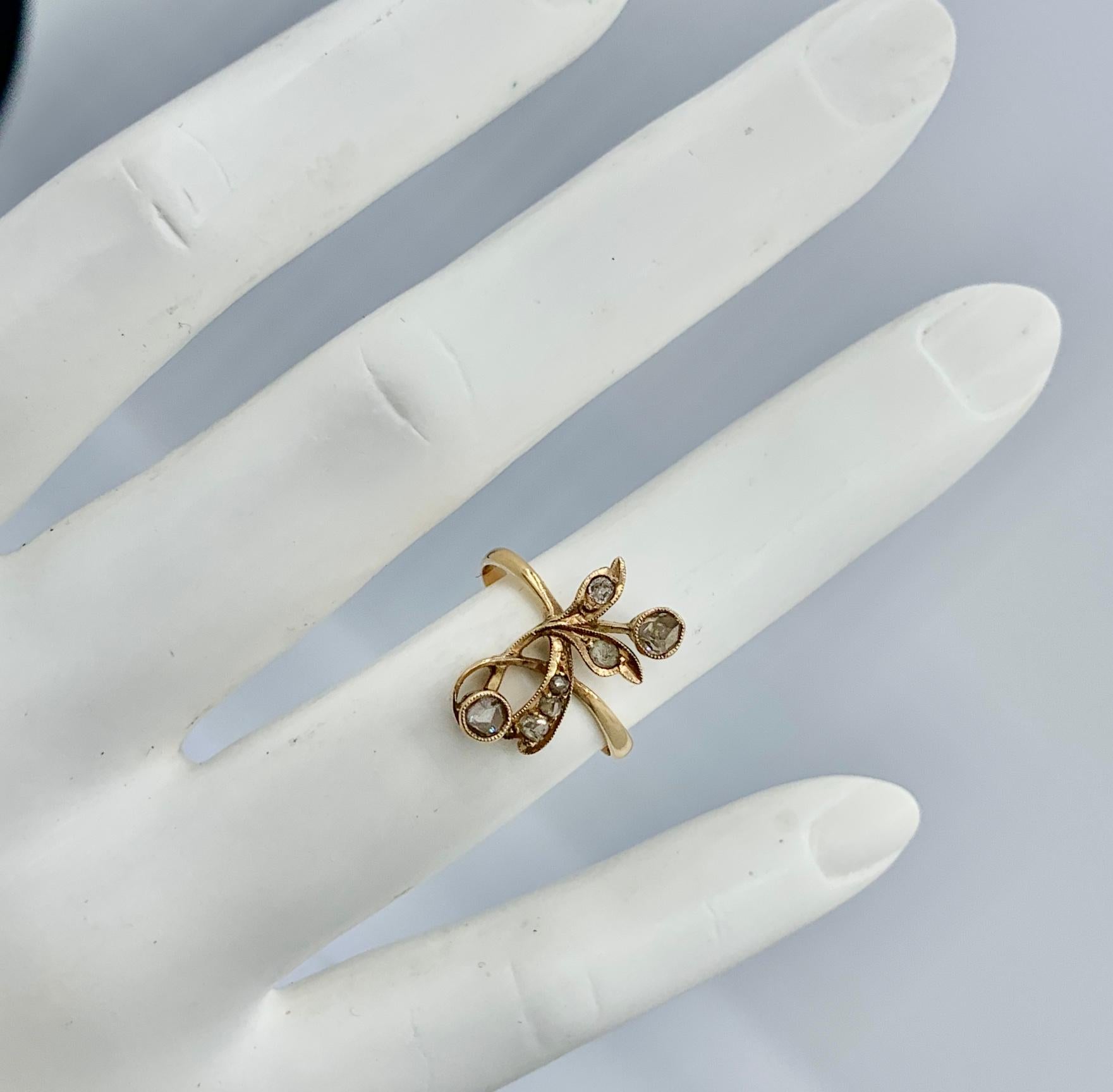 This is an extraordinary antique Art Nouveau, Belle Epoque Rose Cut Diamond Ring in a stunning and very rare Flower motif of great beauty in 18 Karat Gold.   The Rose Cut Diamonds are set in a stunning delicate romantic flower design in 18 Karat