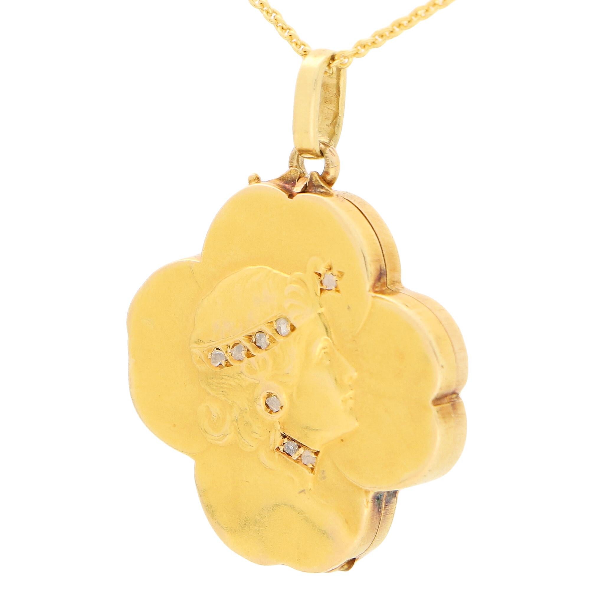 A truly beautiful Art Nouveau rose cut diamond four leaf clover locket set in 18k yellow gold.

The piece is in the form of a lucky four-leaf clover and it outlined on the lid with an elegant looking woman. The woman's headpiece, earrings and choker
