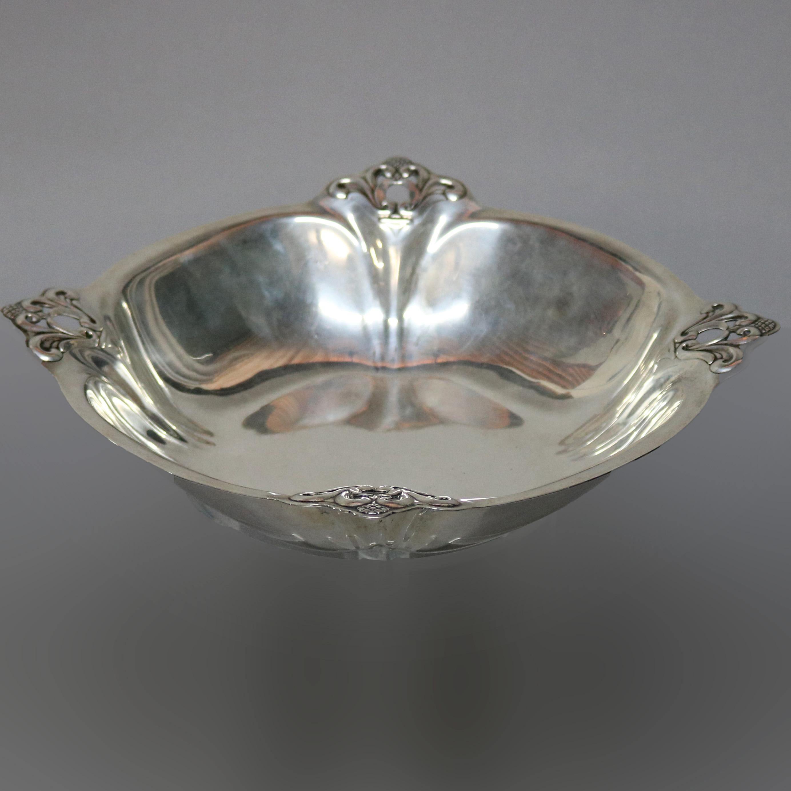 An Art Nouveau sterling silver center bowl by Royal Danish offers square form with pierced foliate corners, elements of Mid-Century Modern, marked on base as photographed, 22.2 toz, circa 1930.

Measures - 2.5
