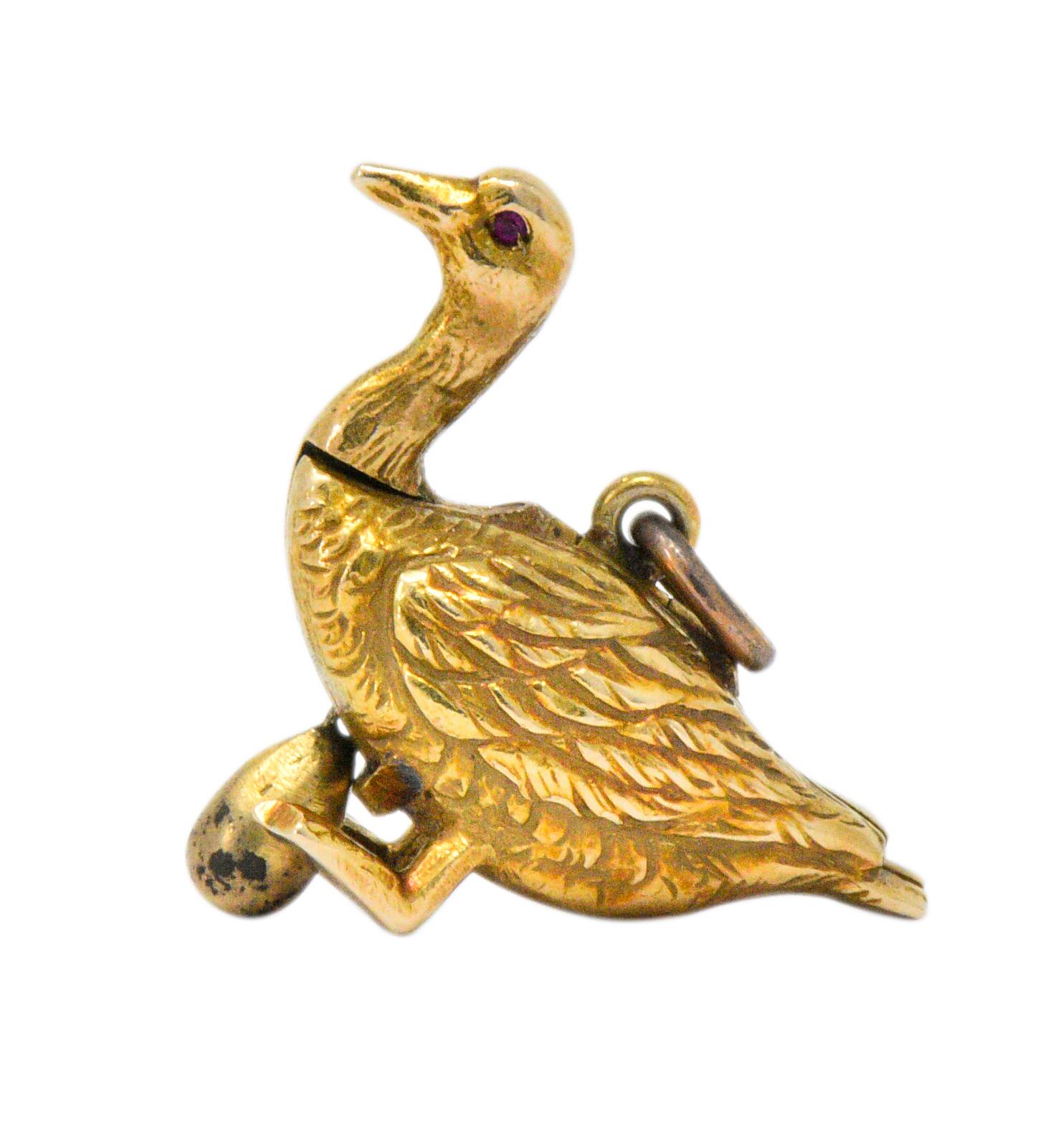 Designed as a goose with tiny ruby eye

Opens to reveal a golden egg attached with a chain

Fantastic engraved gold detail showing texture and feathers

Stamped 14 karat

Measures: Approx. 1 x 1/4 Inches

Total Weight: 3.1 Grams

Luck. Abundance.