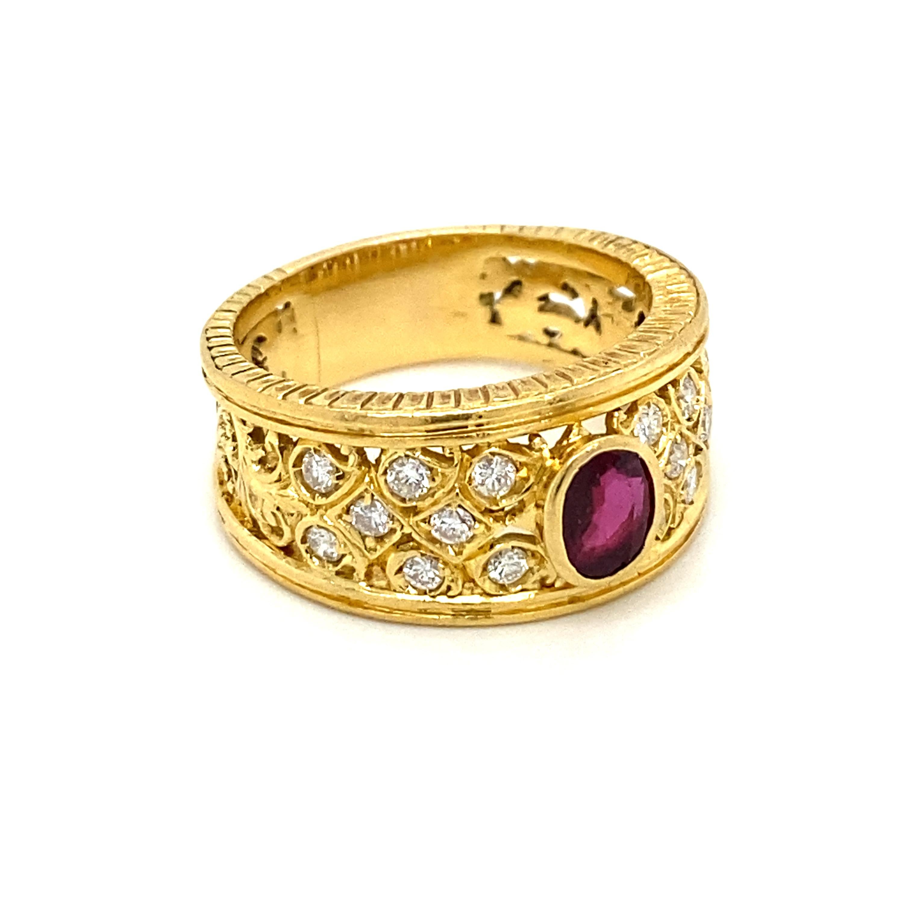 18k yellow gold band ring, handcrafted in Italy, featuring approx. 1,20 ct. Natural Oval shaped Ruby, adorned with approx. 0.50 ct. in H/VS European cut diamonds. The engraving work make this piece unique

CONDITION: Pre-Owned - Excellent 
METAL: