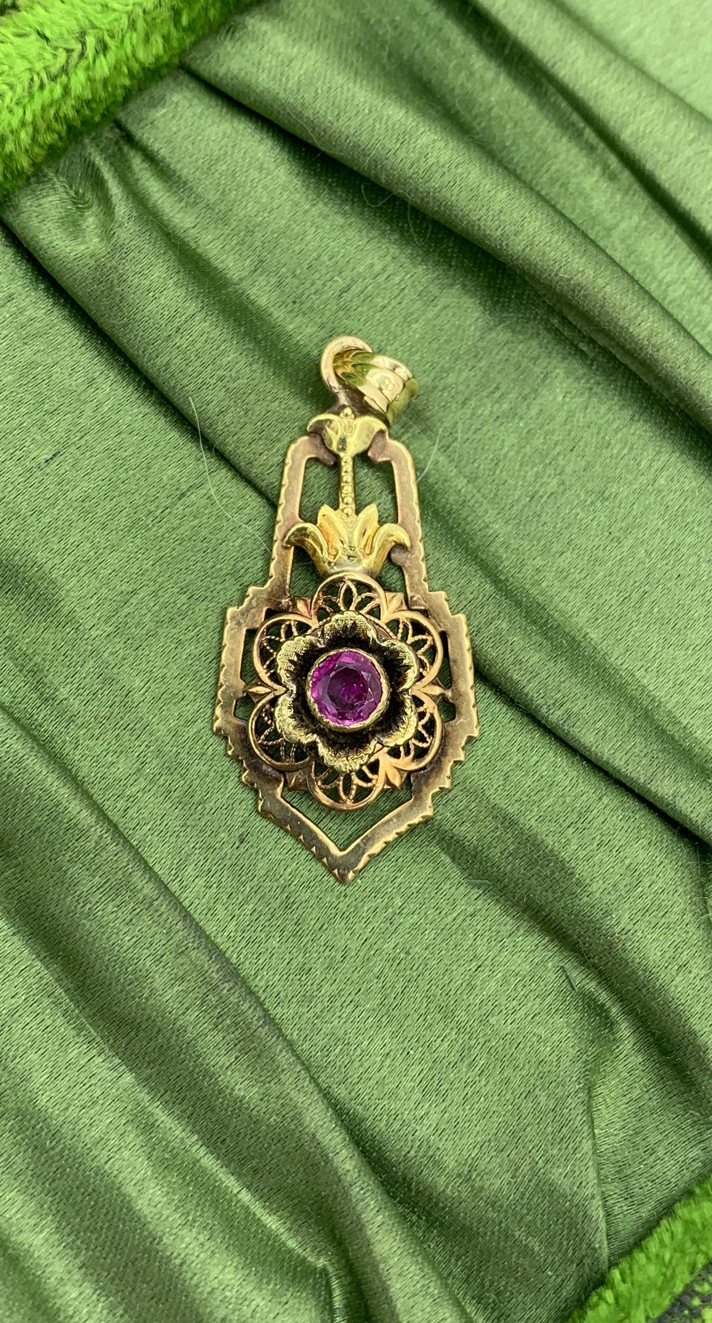 THIS IS AN ART NOUVEAU - BELLE EPOQUE PENDANT IN THE FORM OF A FLOWER WITH A GORGEOUS NATURAL MINED RUBY IN THE CENTER.   THE LAVALIERE IS SO STUNNING WITH THE MOST WONDERFUL THREE DIMENSIONAL DEPICTION OF THE FLOWER.   THE RUBY IS A FINE RED ROUND