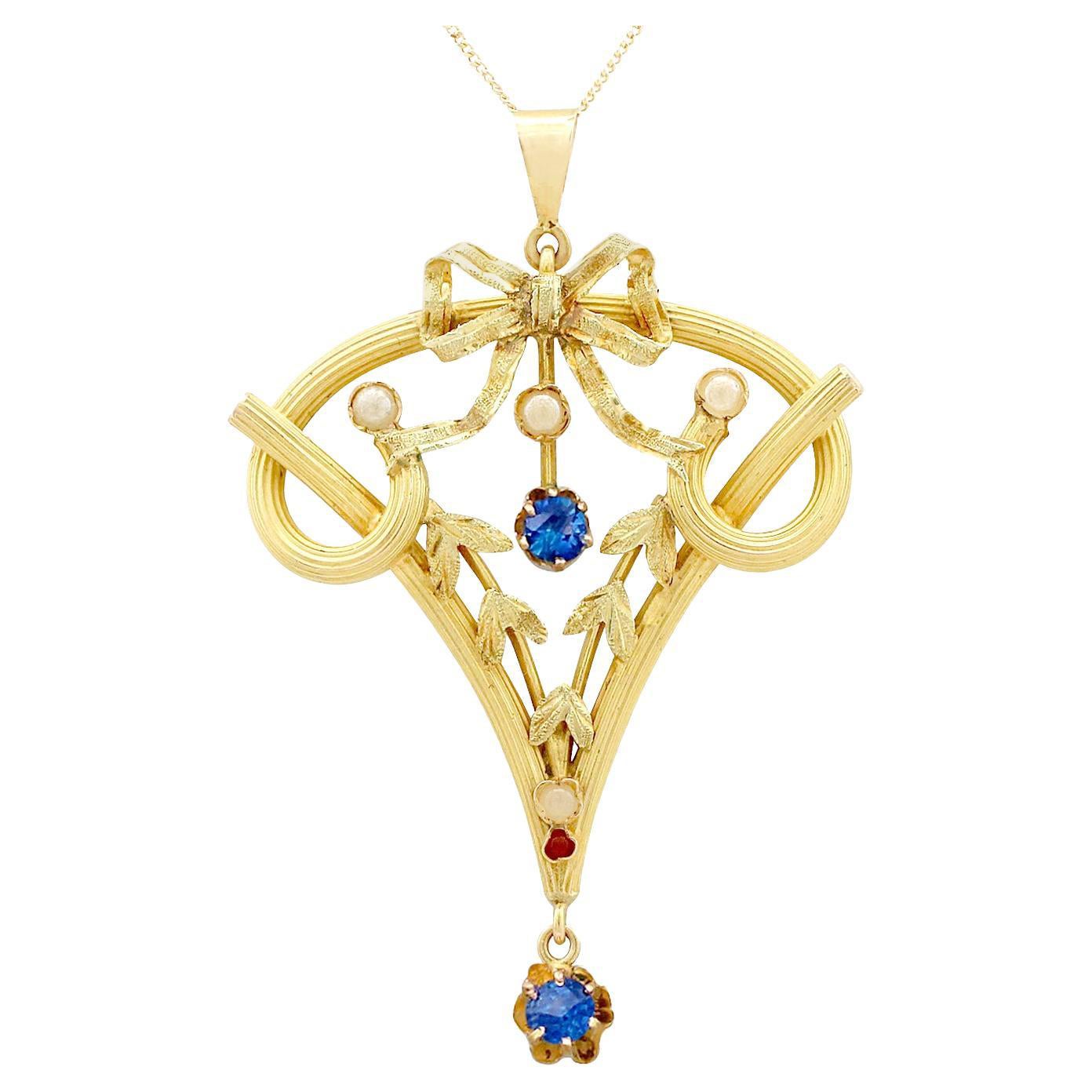 Colgante Art Nouveau de oro amarillo de 21k con rubí, zafiro y perla semillera