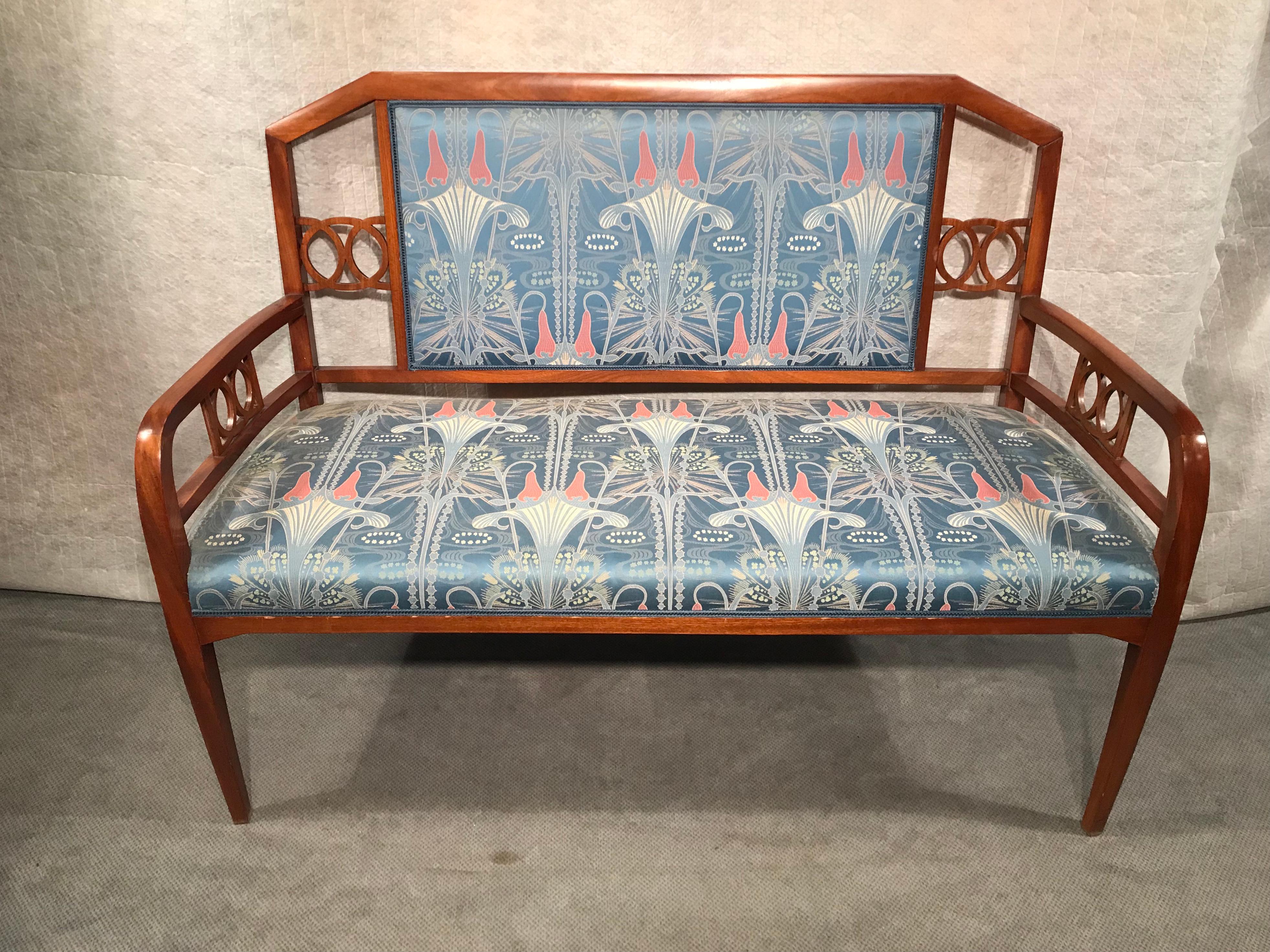 This beautiful Art Nouveau Salon Suite dates back to around 1900-10 and comes from Vienna. The set includes a bench and two armchairs. The fruitwood frame is in very good condition and has some very pretty design details. The upholstery and fabric