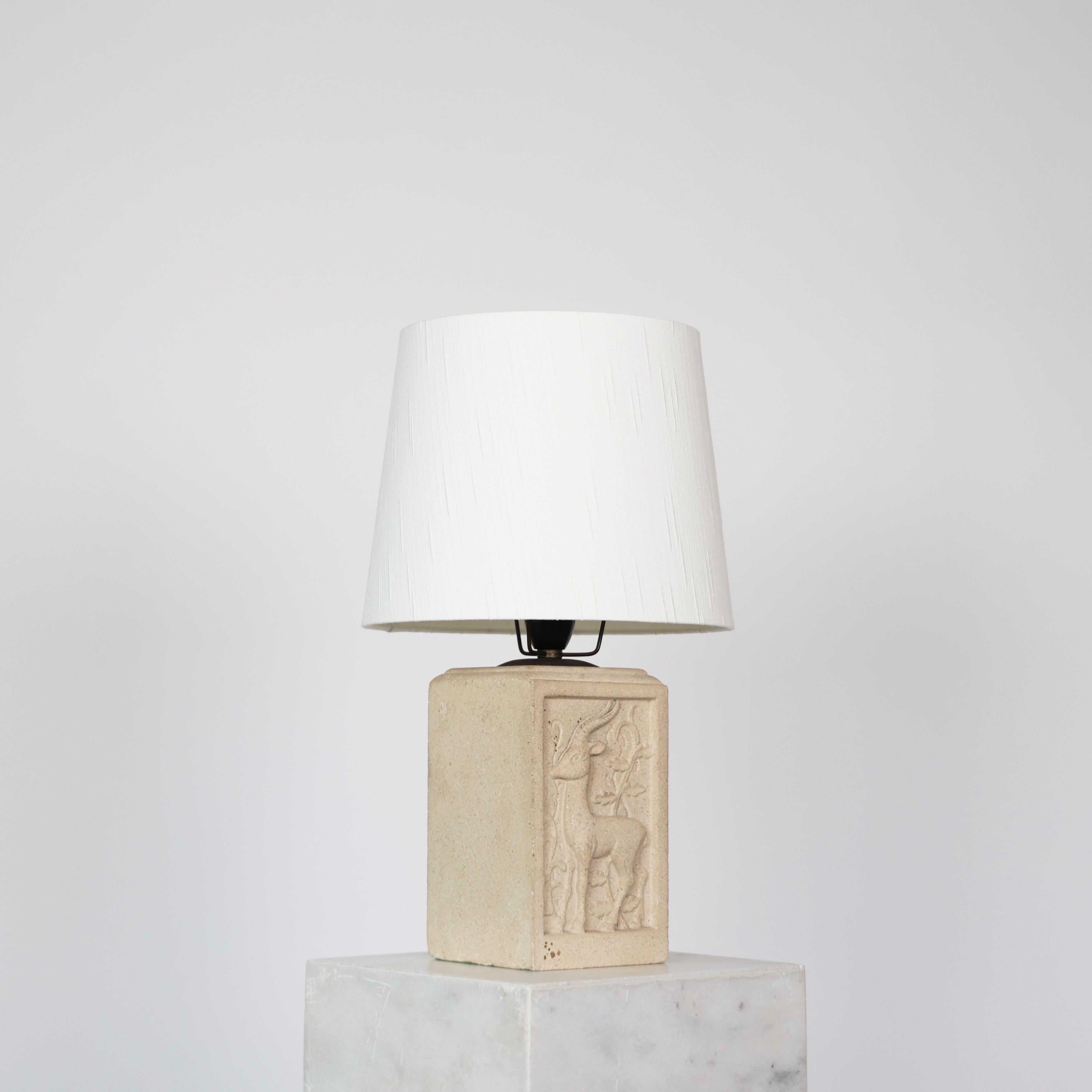 Danish Art Nouveau Sandstone Table with Antelope Motif designed in the 1940s.

* Square Sandstone Table with Antelope Motif  and a white fabric shade
* Year: 1940s
* Condition: Good vintage condition. The lamp as a few chips and marks, mainly in the