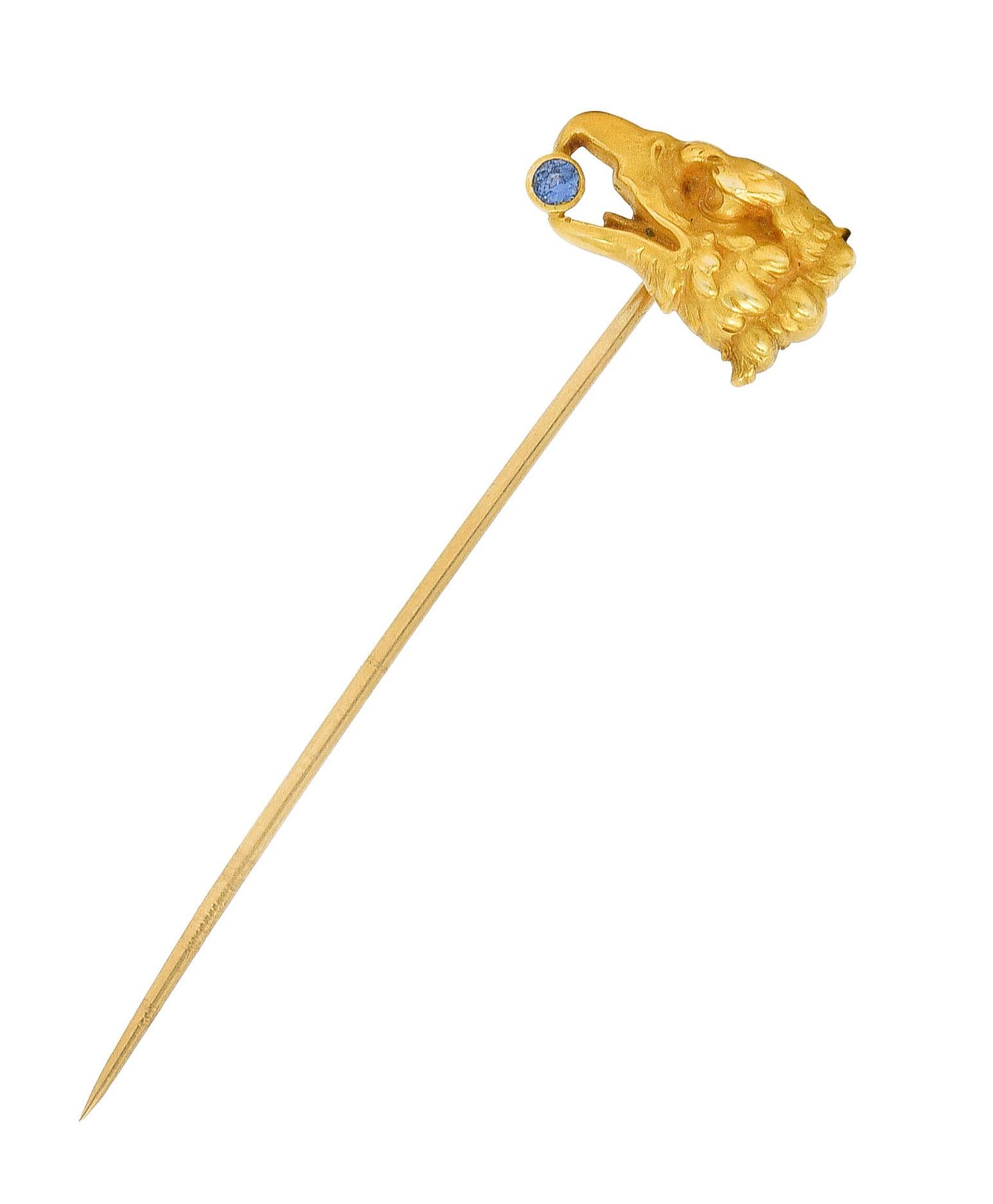 Stickpin designed as stylized eagle bust

Accented by textured feathers with a 2.5 mm round sapphire in beak

Sapphire is medium in saturation and denim blue in color

Stamped 14k for 14 karat gold

Circa: 1905

Eagle head: 5/8 x 7/16 inch

Total