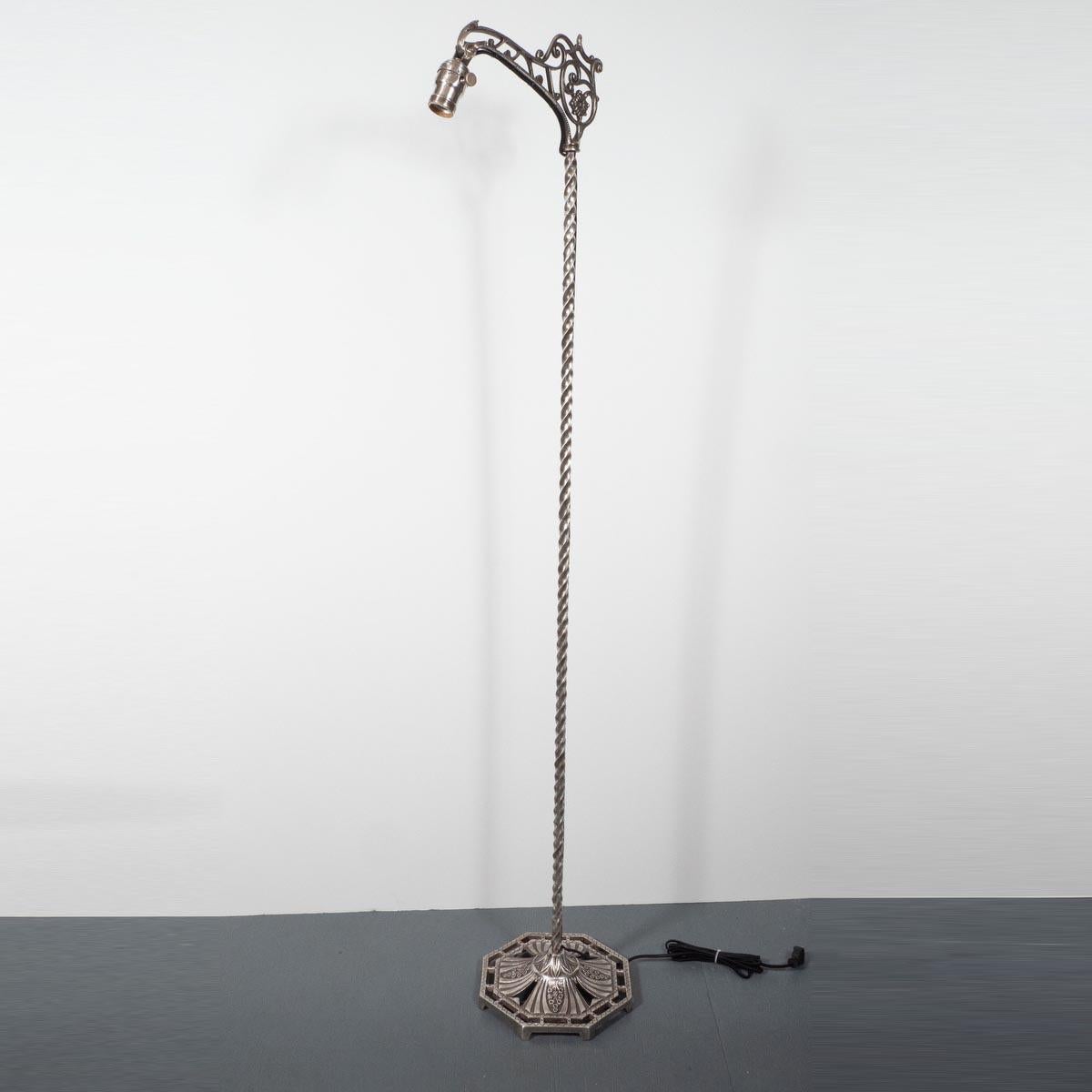 Wrought iron, plated finish, Art Nouveau style floor lamp with foliate and tendril motif.