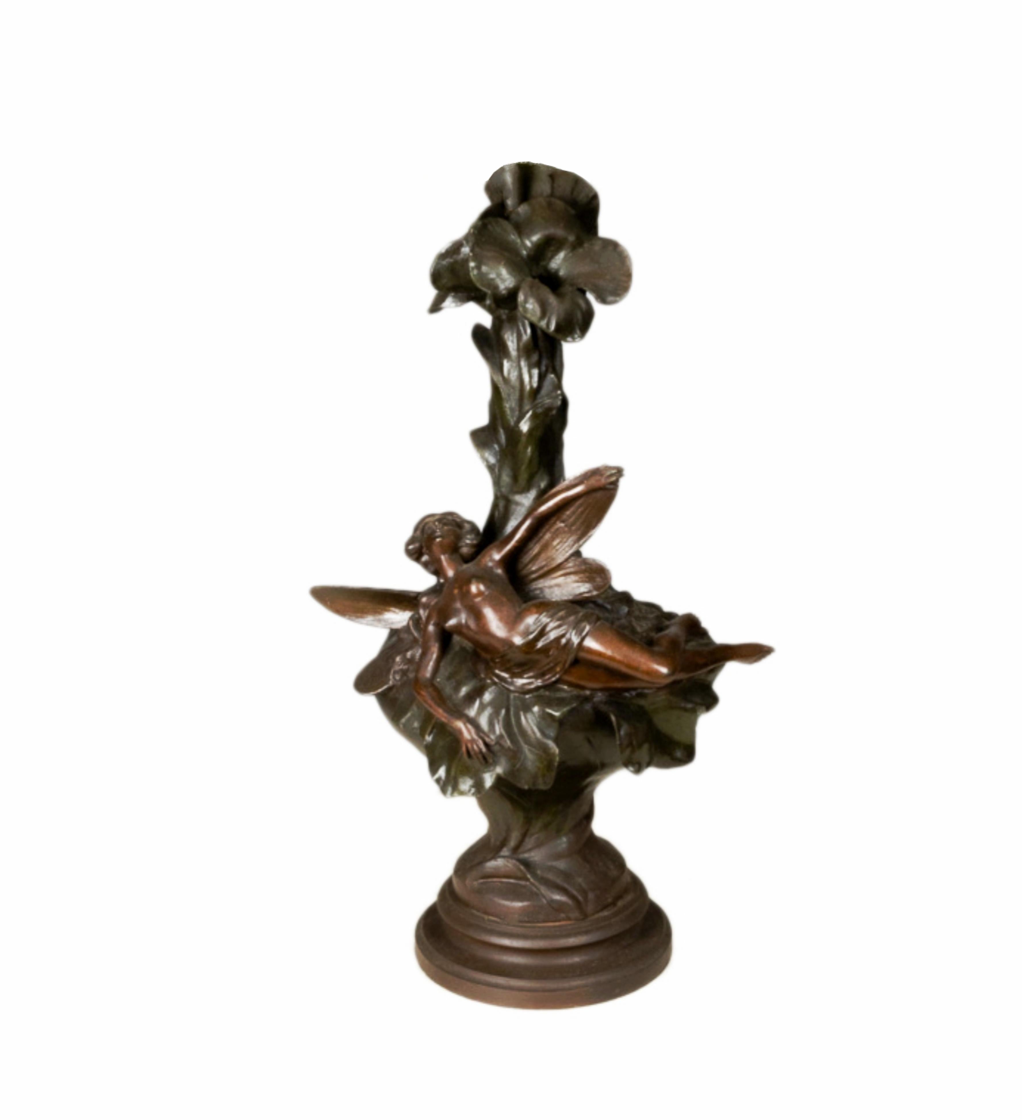 A graceful fairy, reminiscent of Germanic mythology, resting on a blooming water lily vase. The sculpture's intricate details and flowing lines exemplify Art Nouveau's essence.

Dimensions: Height: 22.45 in (57 cm)Diameter: 11.03 in (28 cm)
