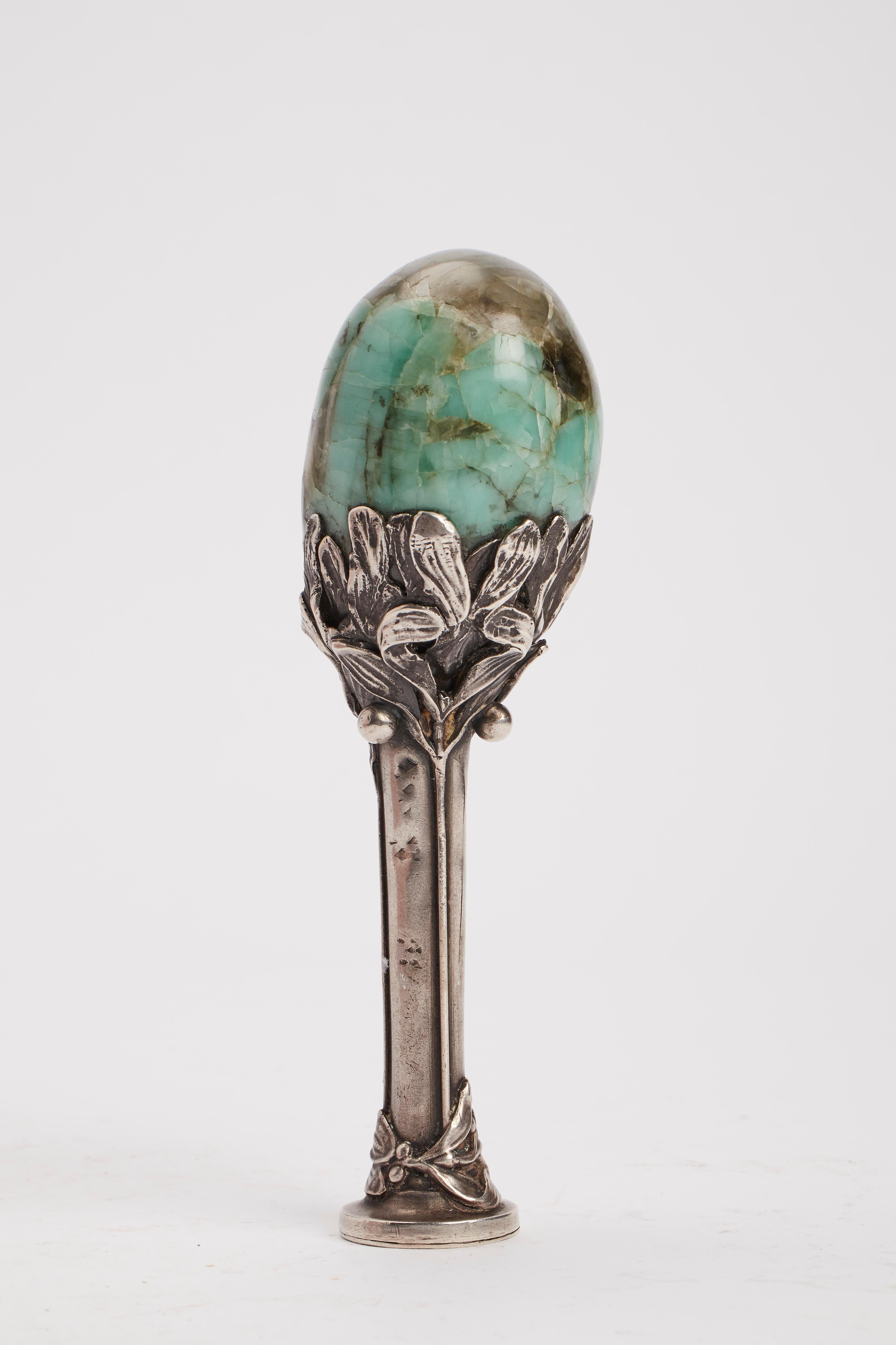 Art Nouveau seal made out of silver depicting mistletoe. The handle made out of semi-precious stone. France, 1900.