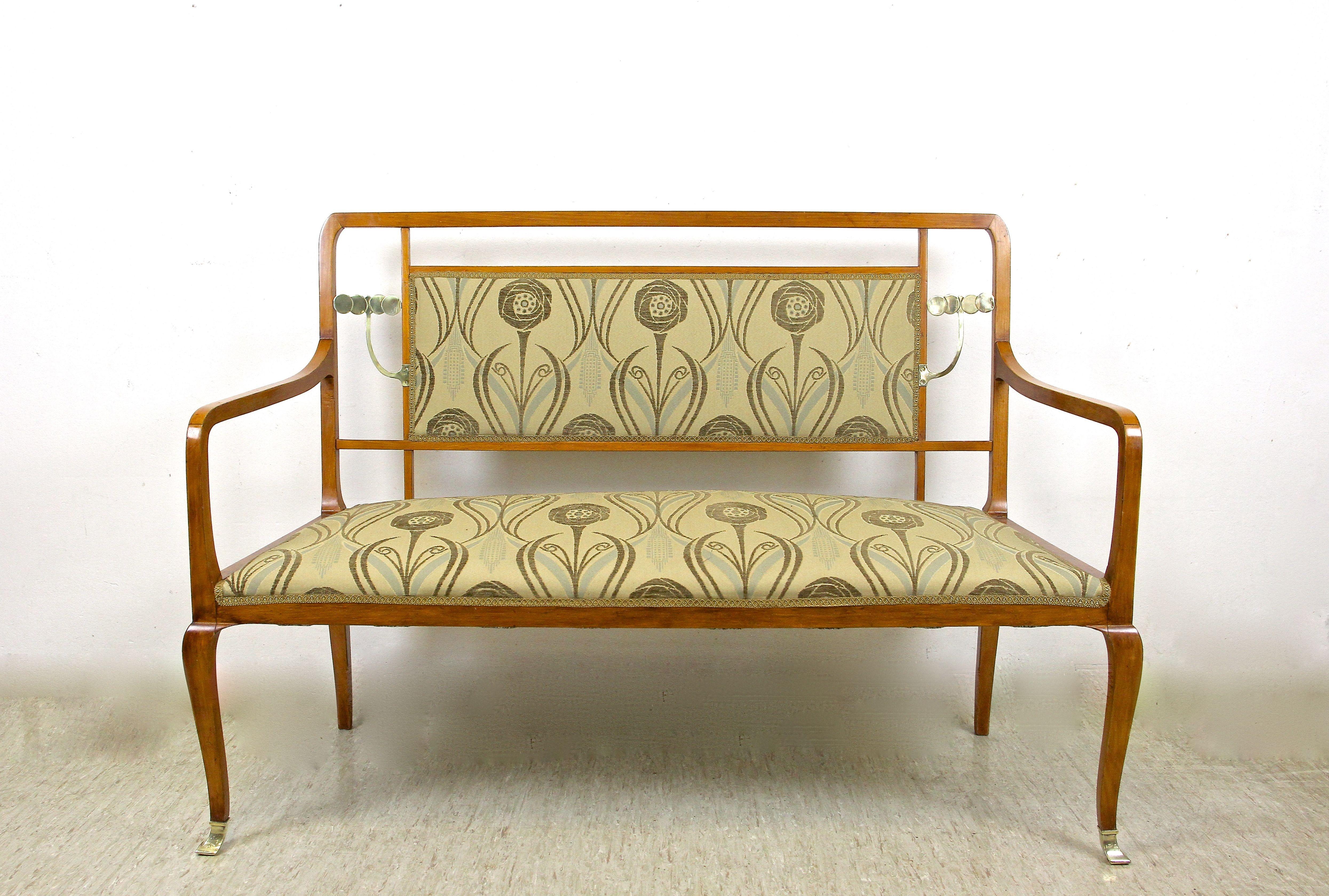 Unique Art Nouveau seating set with matching table from the period in Austria around 1910. This remarkable seating set consists of two chairs, one bench and a table. Made of fine beech wood which has been trimmed to a great looking cherry tone, this
