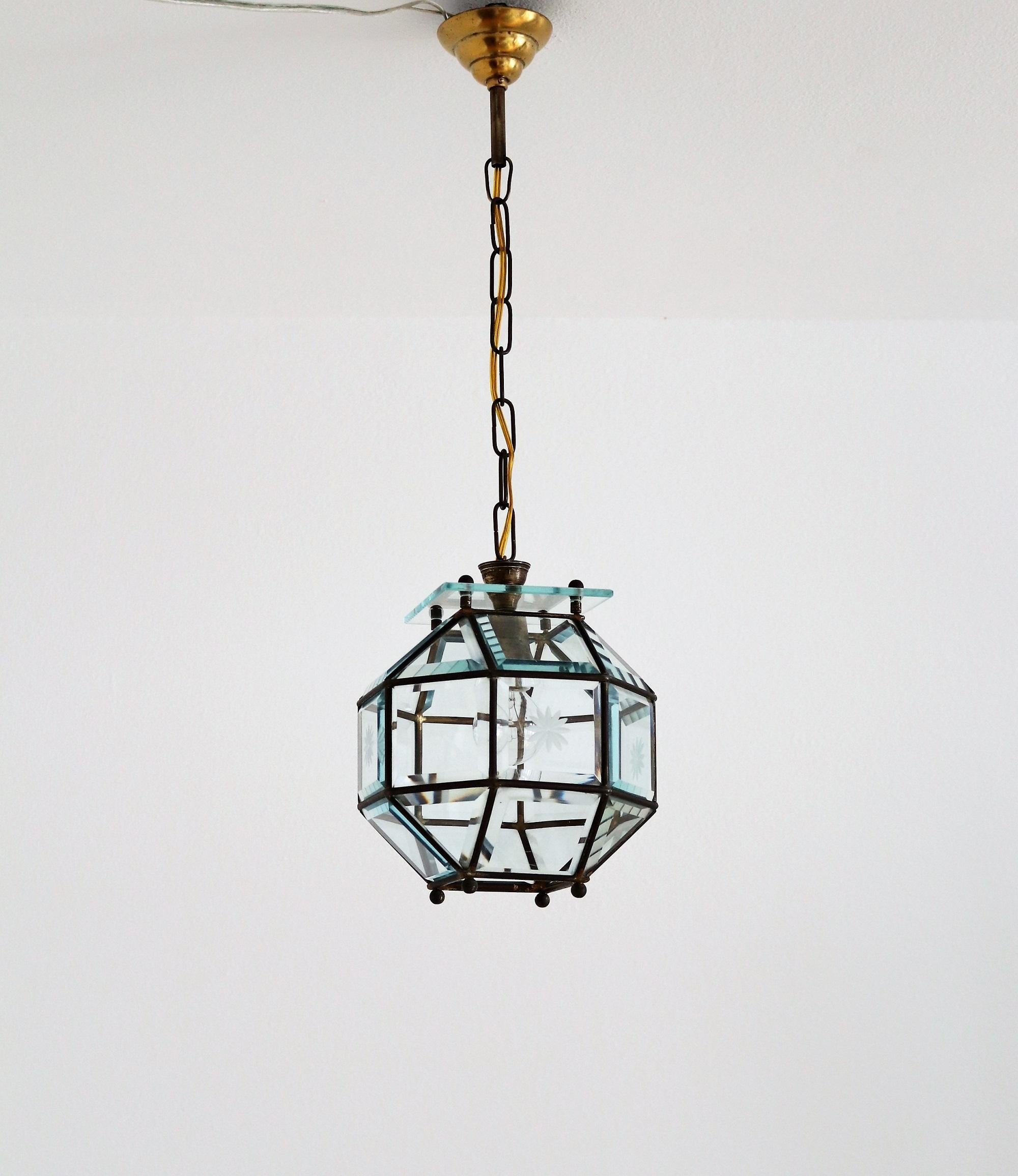 Beautiful lantern or pendant lamp made of shiny cut crystal glass and full brass lamp frame.
Made in the manner of Adolf Loos, an Art Nouveau Austrian secessionist.
The brass of the lamp has got a beautiful dark patina over the years. There are