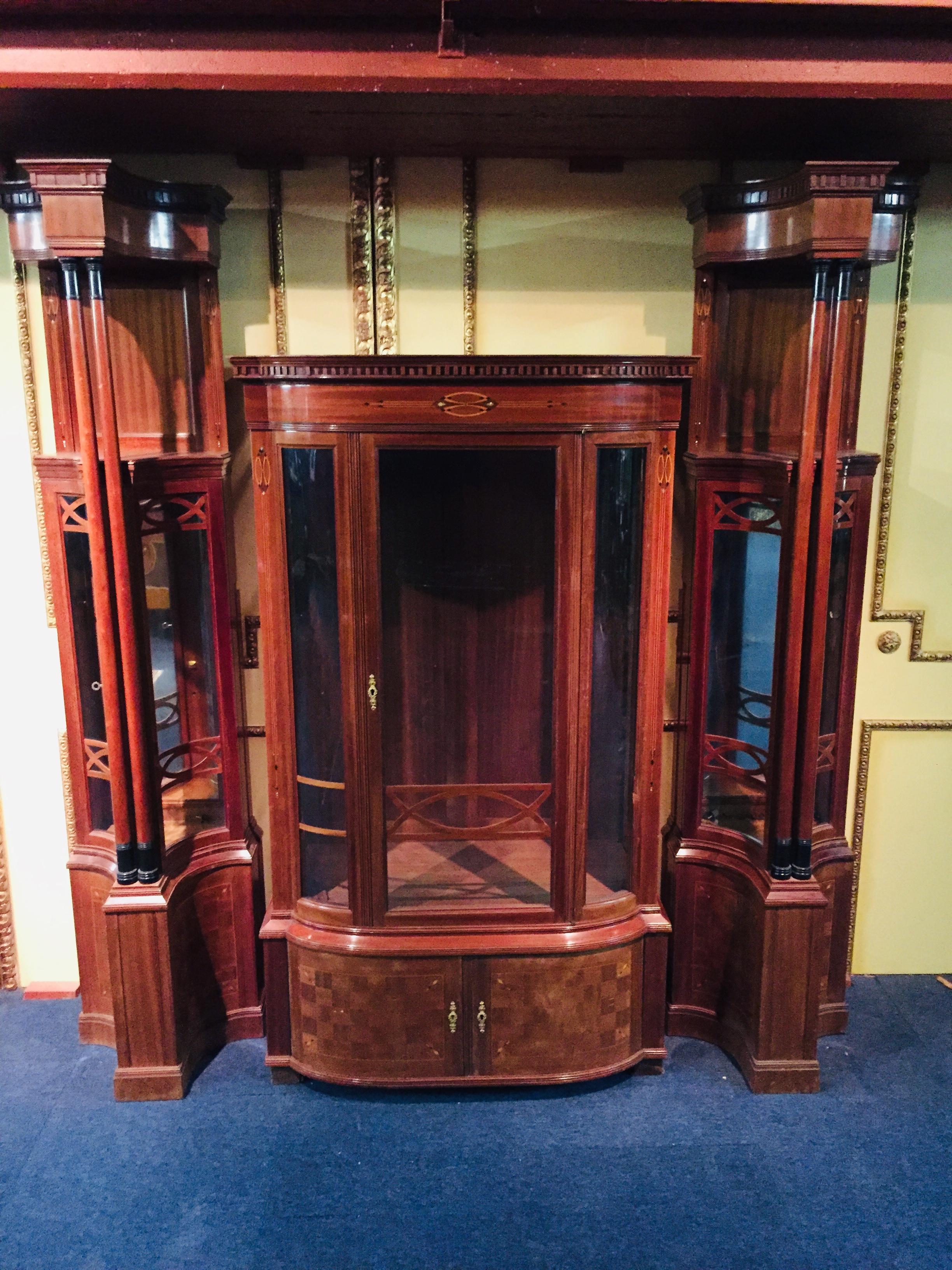 Art Nouveau large showcase with 2 narrow showcases on the right and left side.

Dimensions.
large display case
Width 92cm
Height 159cm
Depth 47 cm

Narrow display case
Width 46cm
Height 193cm
Depth 36cm.
 