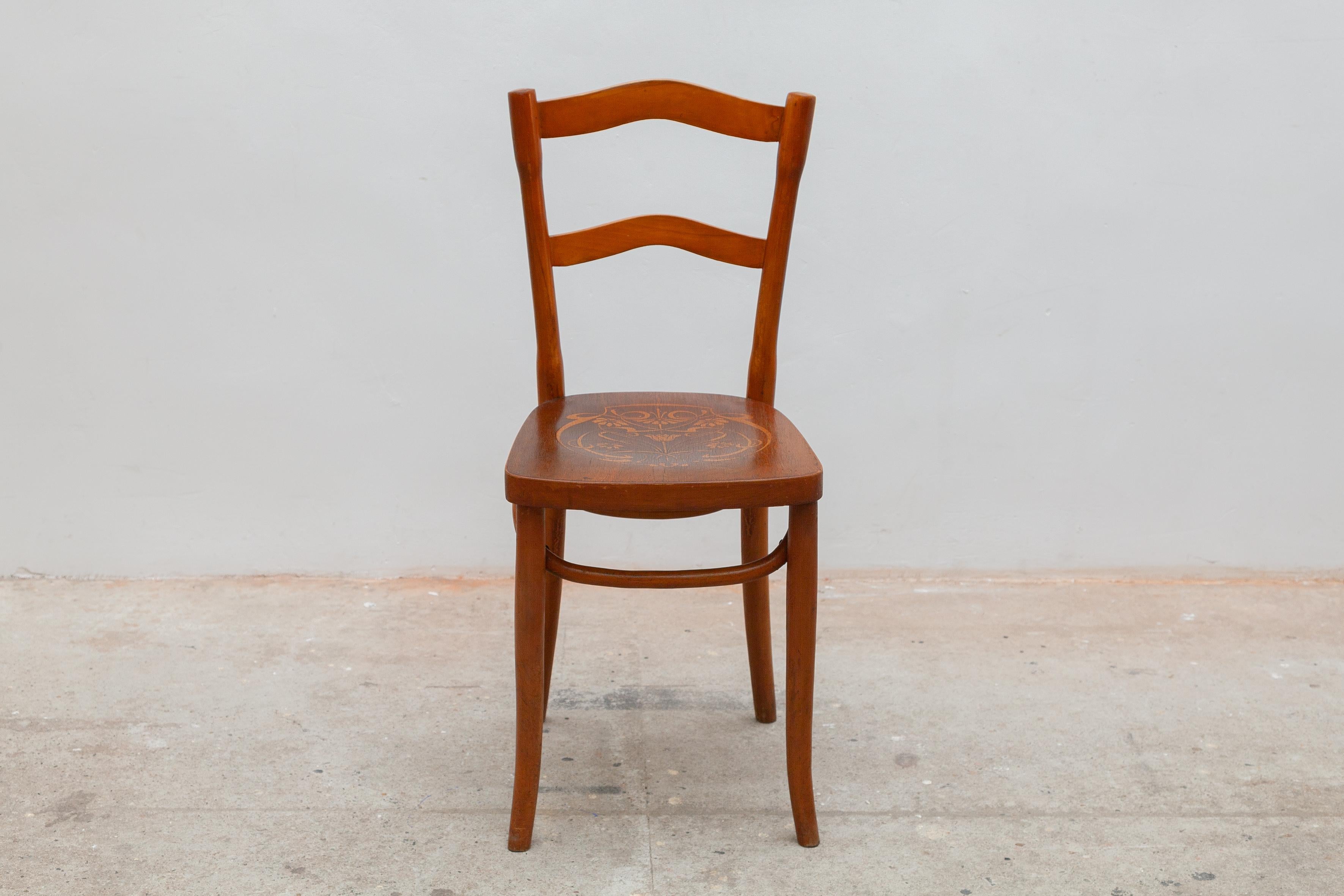 Classic collectible chair by famous German-Austrian cabinetmaker Michael Thonet. Bentwood frame with hooped legs. The seat is embossed with a decorative floral motif.

 