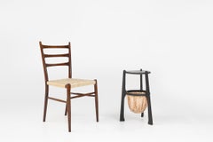 Art Nouveau side table in blackened wood with storage basket, Belgium ca. 1910