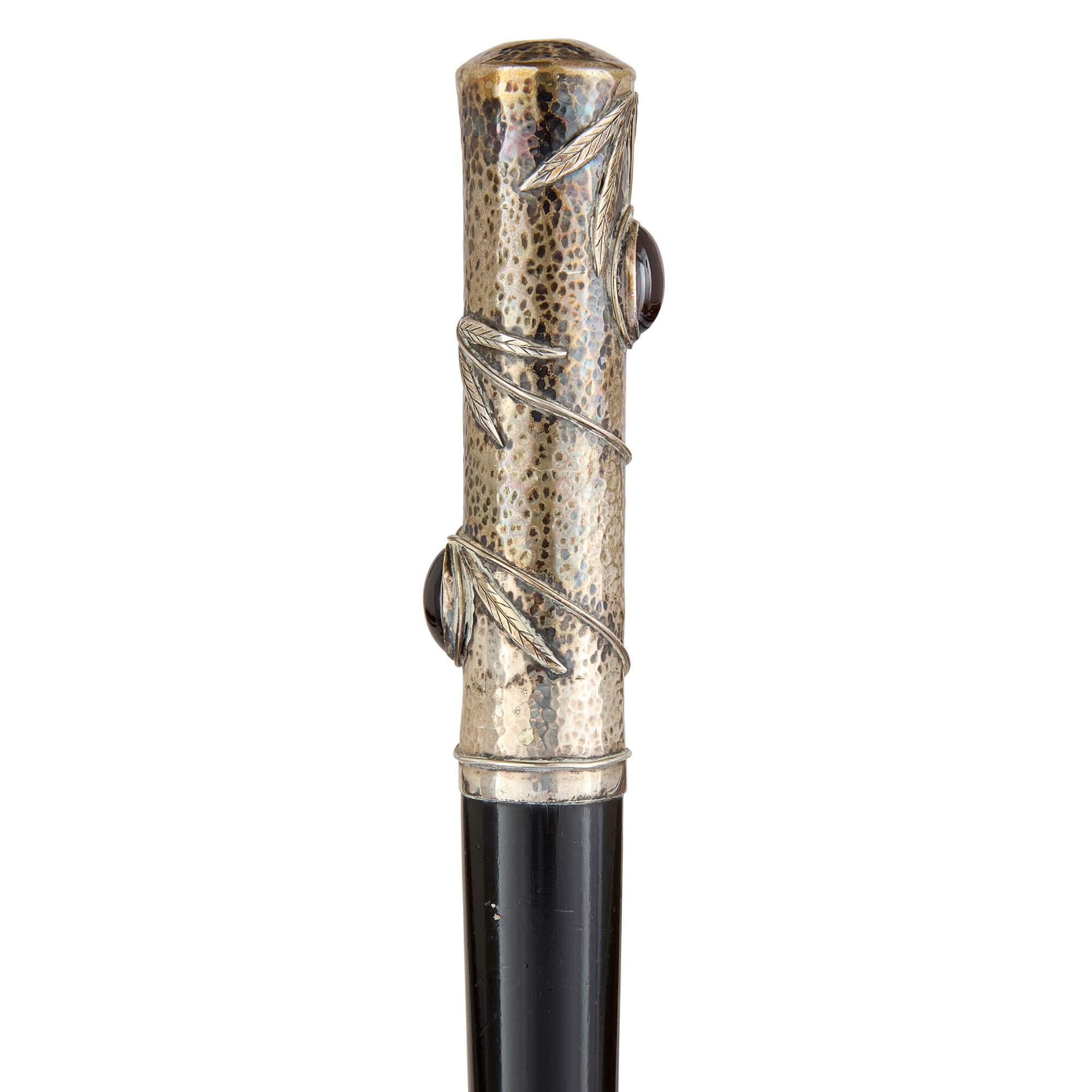Art Nouveau silver and glass mounted walking stick
French, c. 1900 
Height 91cm, diameter 2.5cm

Dating back to late 19th century France, this exceptional walking stick reflects the distinctive artistry of the Art Nouveau movement, a style renowned