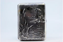 Art Nouveau silver case embossed with young man and floral motifs
