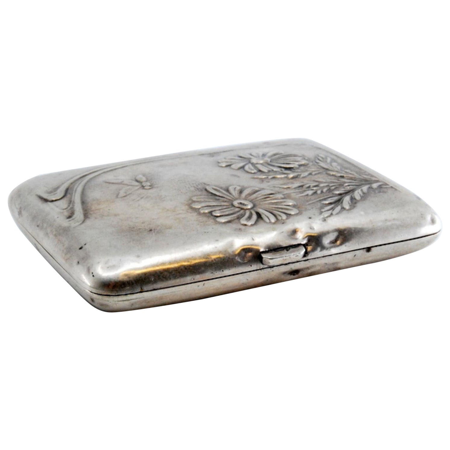 Art Nouveau silver case with embossed floral motifs and hinged lid