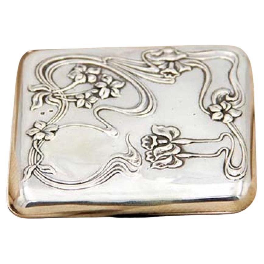 Art Nouveau silver case with high-relief floral elements