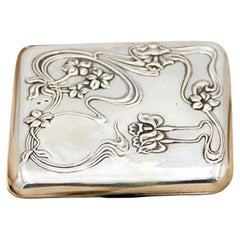 Art Nouveau silver case with high-relief floral elements