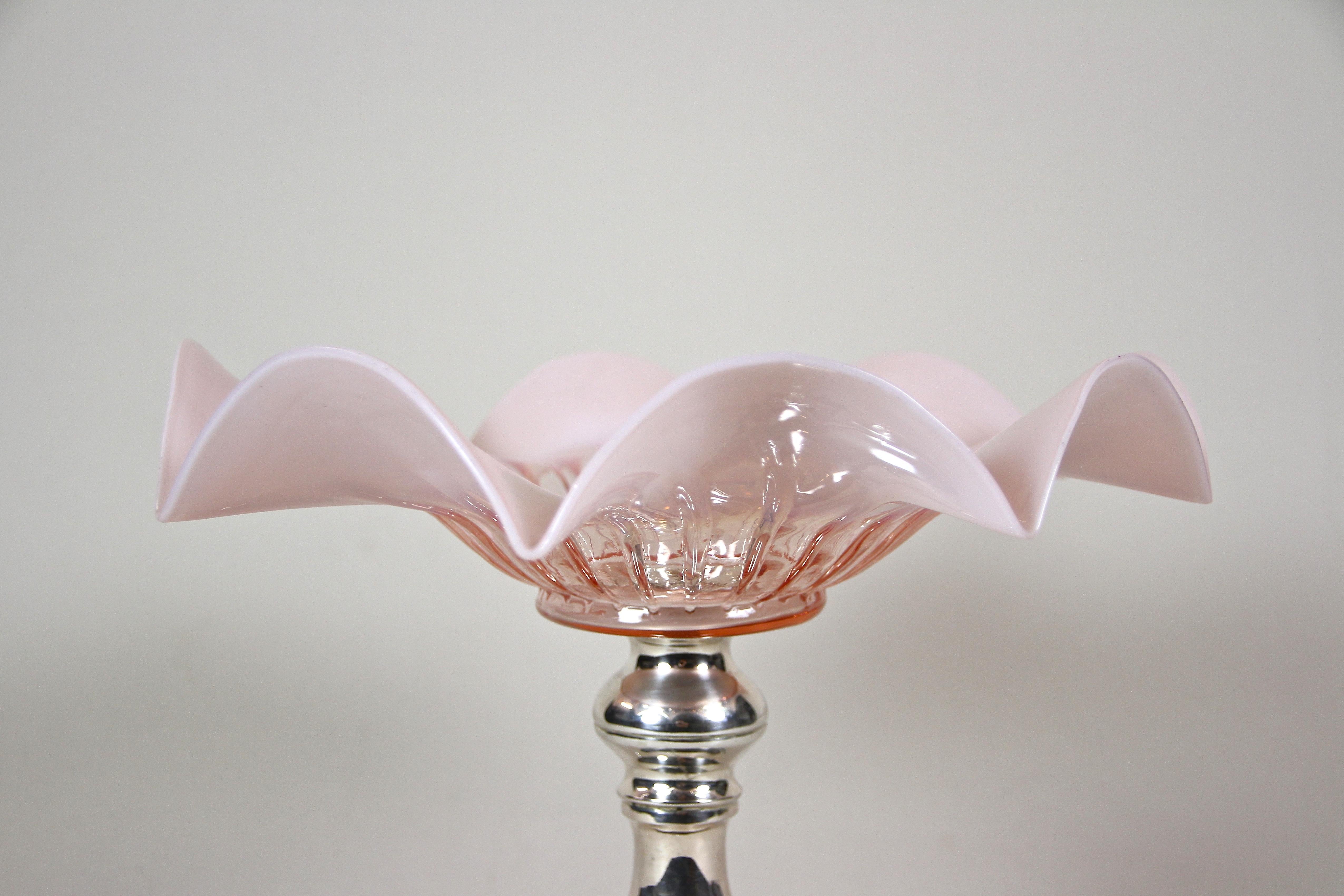 Lovely silver Art Nouveau centerpiece with ruffled glass bowl artfully made in Austria around 1900. A beautiful light pink shining mouth blown glass bowl sits on a fanatstic designed, solid 800 silver base adorned by extraordinary worked feet. The