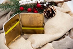 Art Nouveau silver cigarette case with relief horse heads and curved form