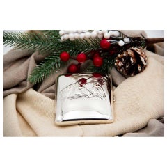 Art Nouveau silver cigarette case with relief horse heads and curved form