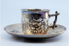 Art Nouveau silver cup and saucer with insects, florals and tree-trunk handle