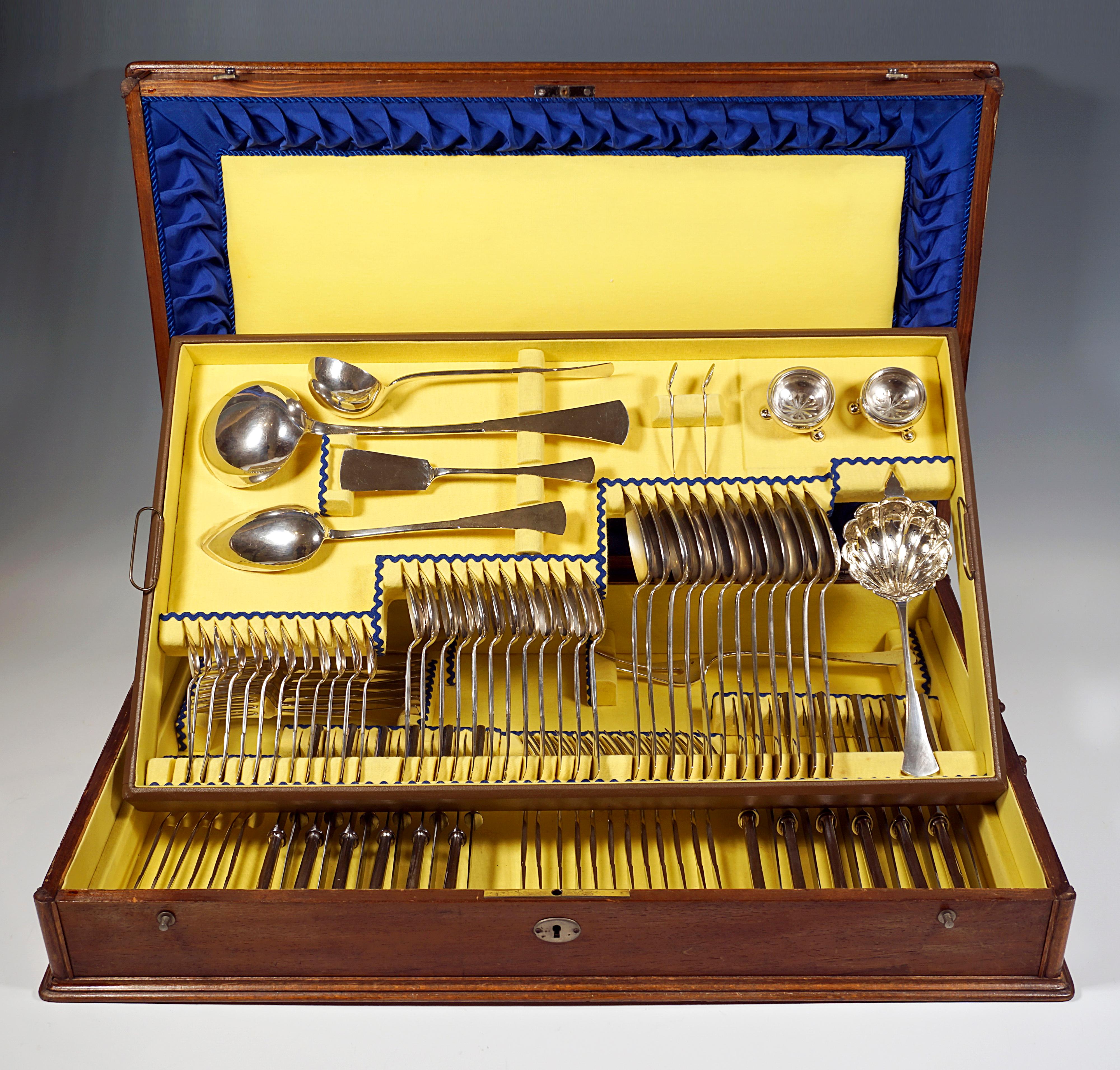 Elegant cutlery set made of solid silver for twelve people consisting of 95 parts in original wooden box.
 
Dateing: circa 1900

Material: Massive silver '800'

Form type: Elegant, simple design with slender bars that fan out at the end of the