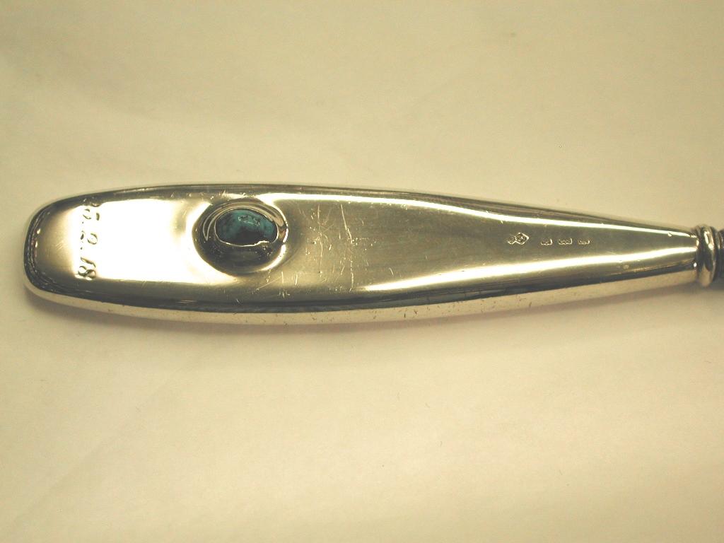 Silver handled button hook and shoe horn, set with turquiose matrix, with steel Horn and steel hook.
Made in the Art Nouveau period by the world famous 