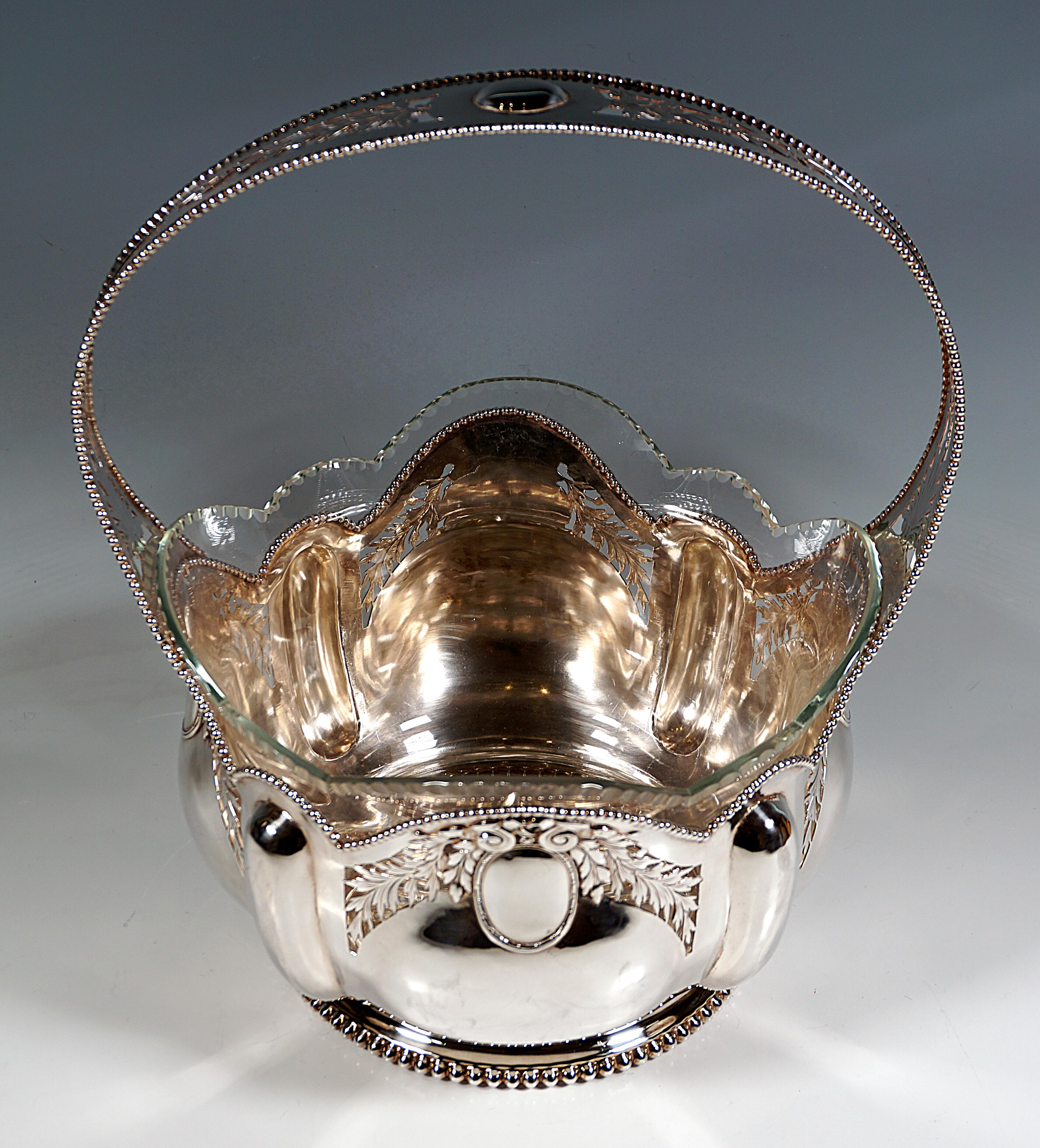 Elegant Art Nouveau silver centerpiece:
Body on a round stand stepped by a fluting and with an embossed beaded rim, vessel widening rhythmically in differently sized, tongue-shaped bulges, openwork decoration in four places with medallions