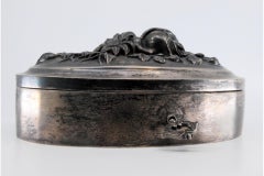 Art Nouveau silver jewelry box with relief lid, key and velvet interior