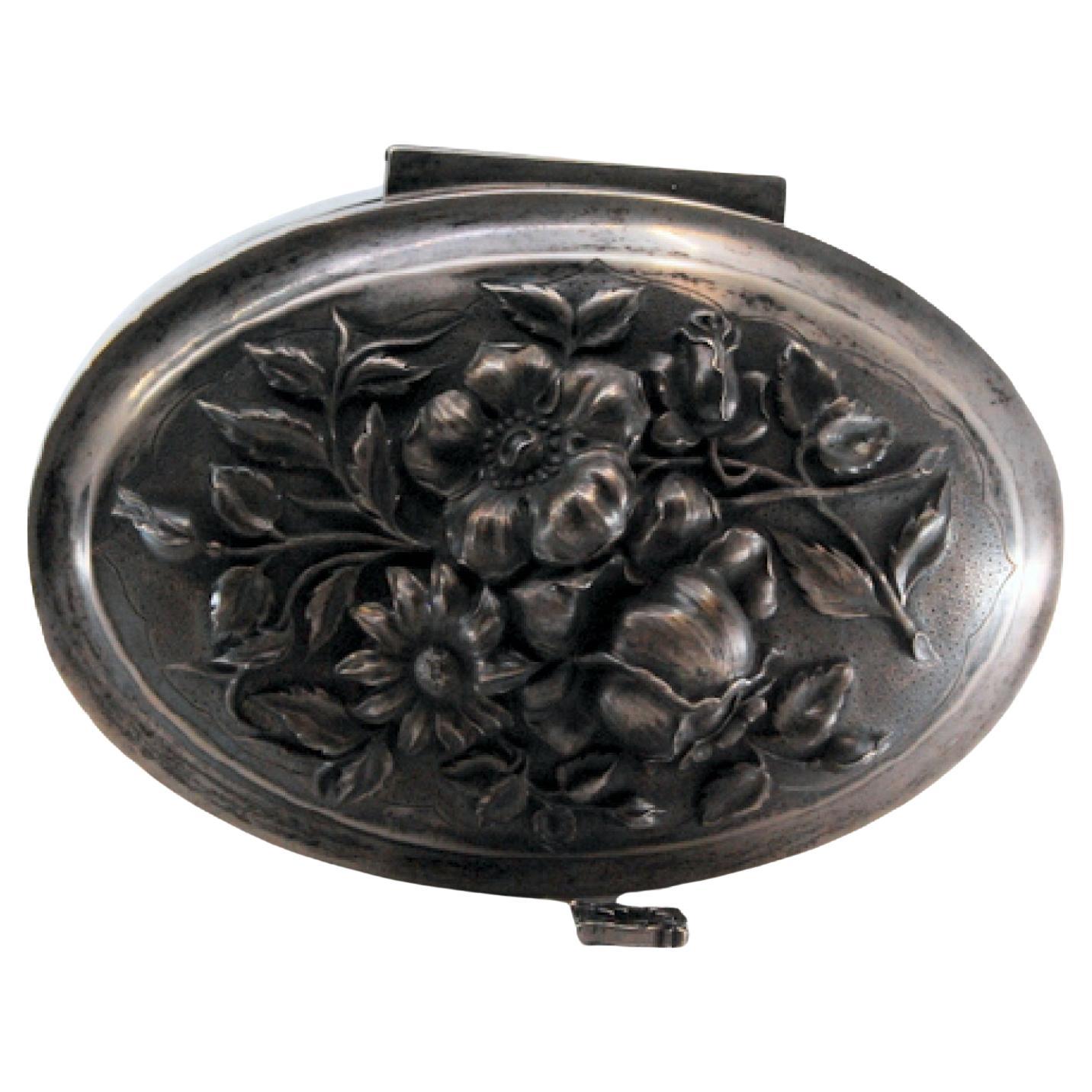 Art Nouveau silver jewelry box with relief lid, key and velvet interior
