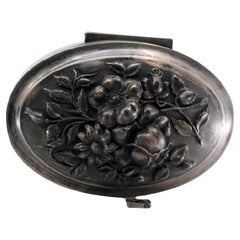 Art Nouveau silver jewelry box with relief lid, key and velvet interior